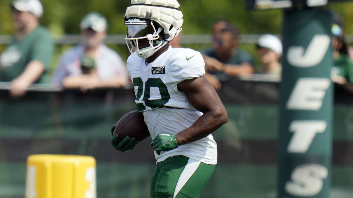 FILE - New York Jets' Breece Hall runs a drill during a practice at the NFL football team's training facility in Florham Park, N.J., Tuesday, July 30, 2024.