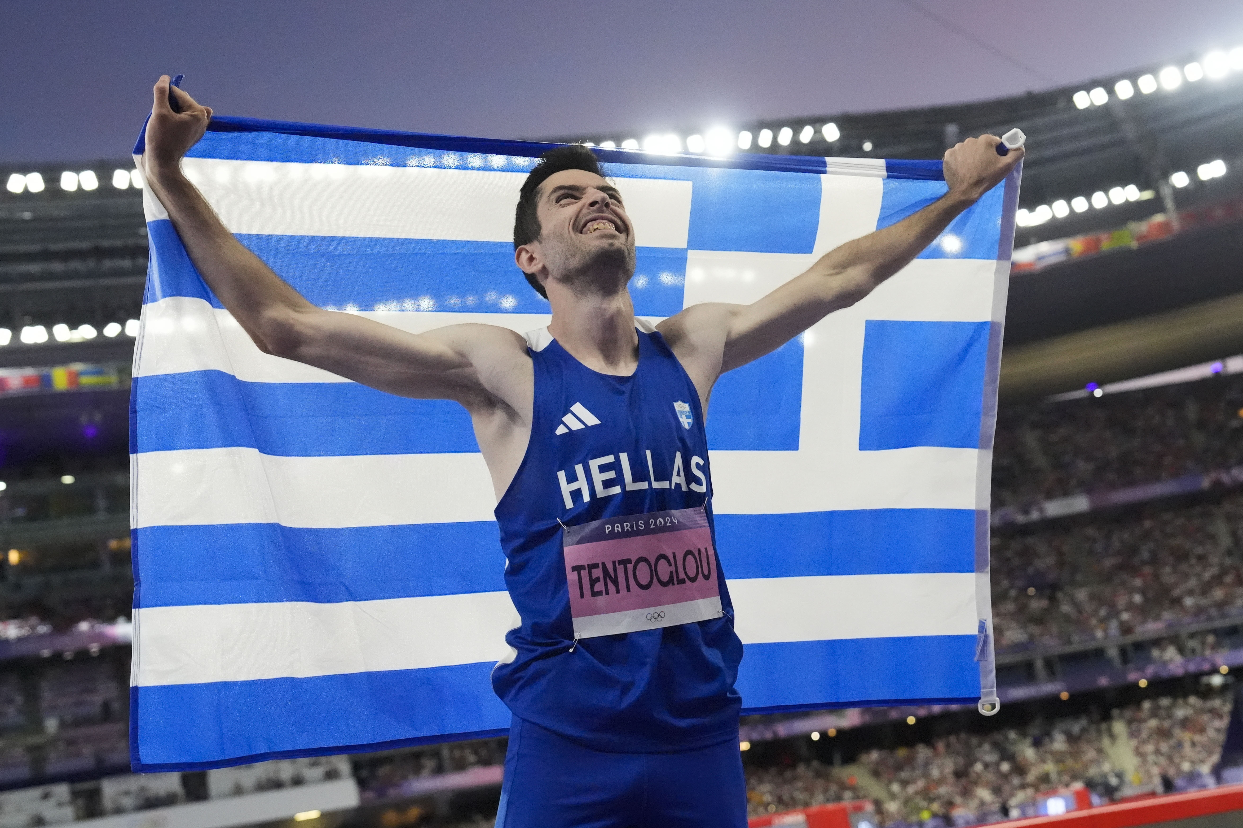 Miltiadis Tentoglou, of Greece, celebrates after winning the men's long jump final at the 2024 Summer Olympics, Tuesday, Aug. 6, 2024, in Saint-Denis, France. 