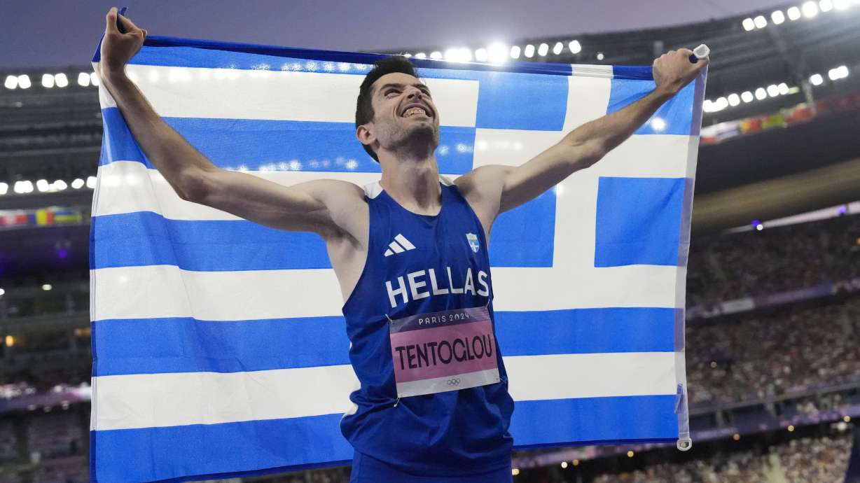Miltiadis Tentoglou, of Greece, celebrates after winning the men's long jump final at the 2024 Summer Olympics, Tuesday, Aug. 6, 2024, in Saint-Denis, France.