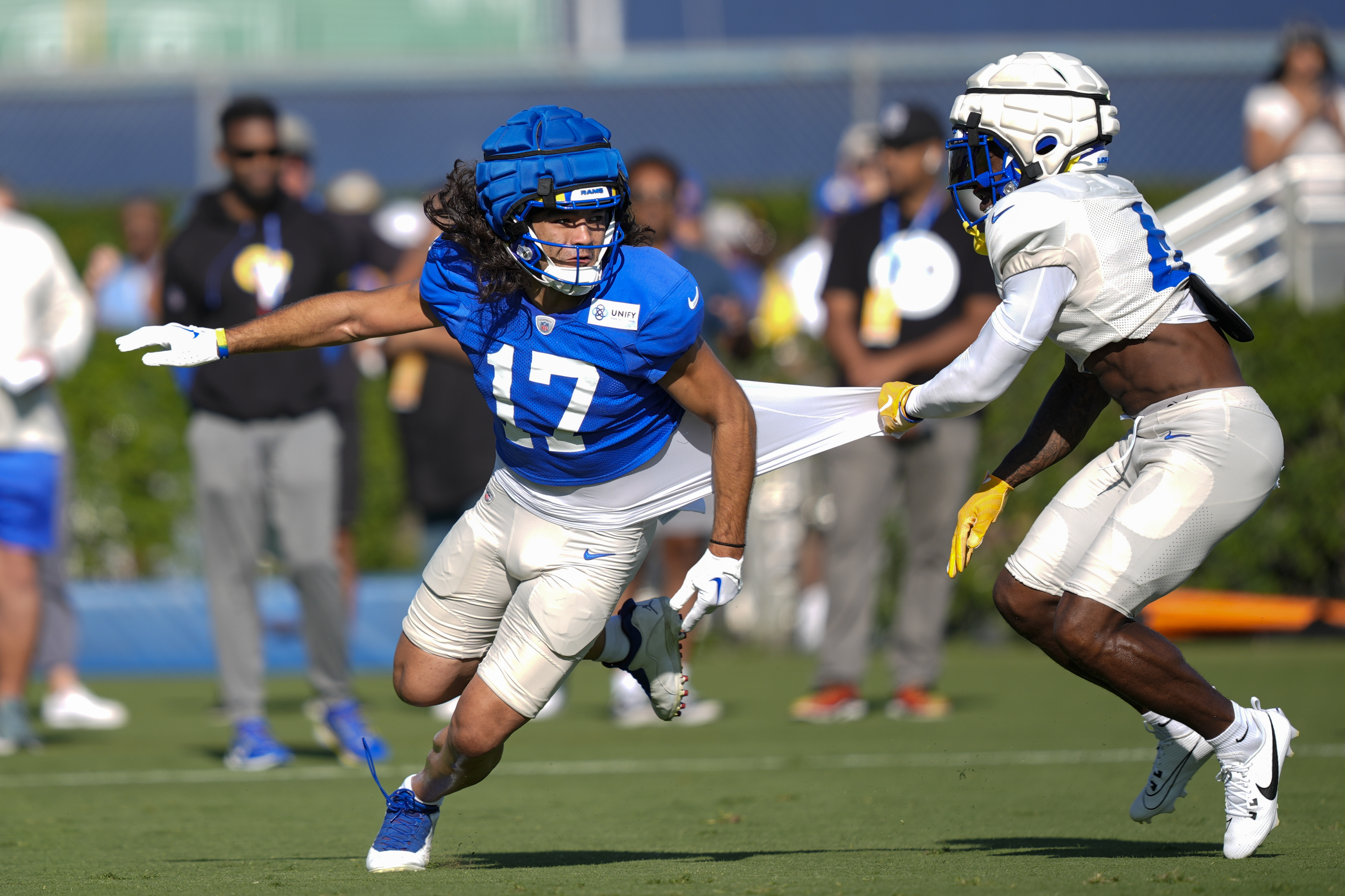Los Angeles Rams wide receiver Puka Nacua, left, and defensive back Jerry Jacobs run drills during NFL football training camp Monday, July 29, 2024, in Los Angeles. 
