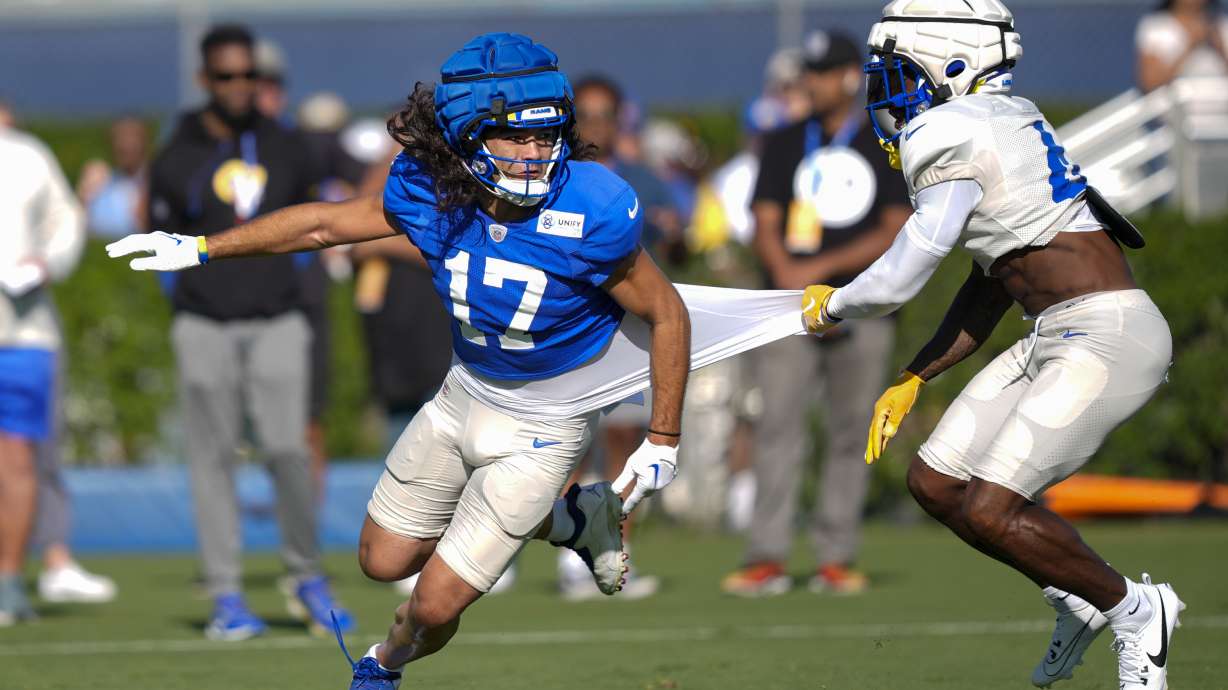 Los Angeles Rams wide receiver Puka Nacua, left, and defensive back Jerry Jacobs run drills during NFL football training camp Monday, July 29, 2024, in Los Angeles.
