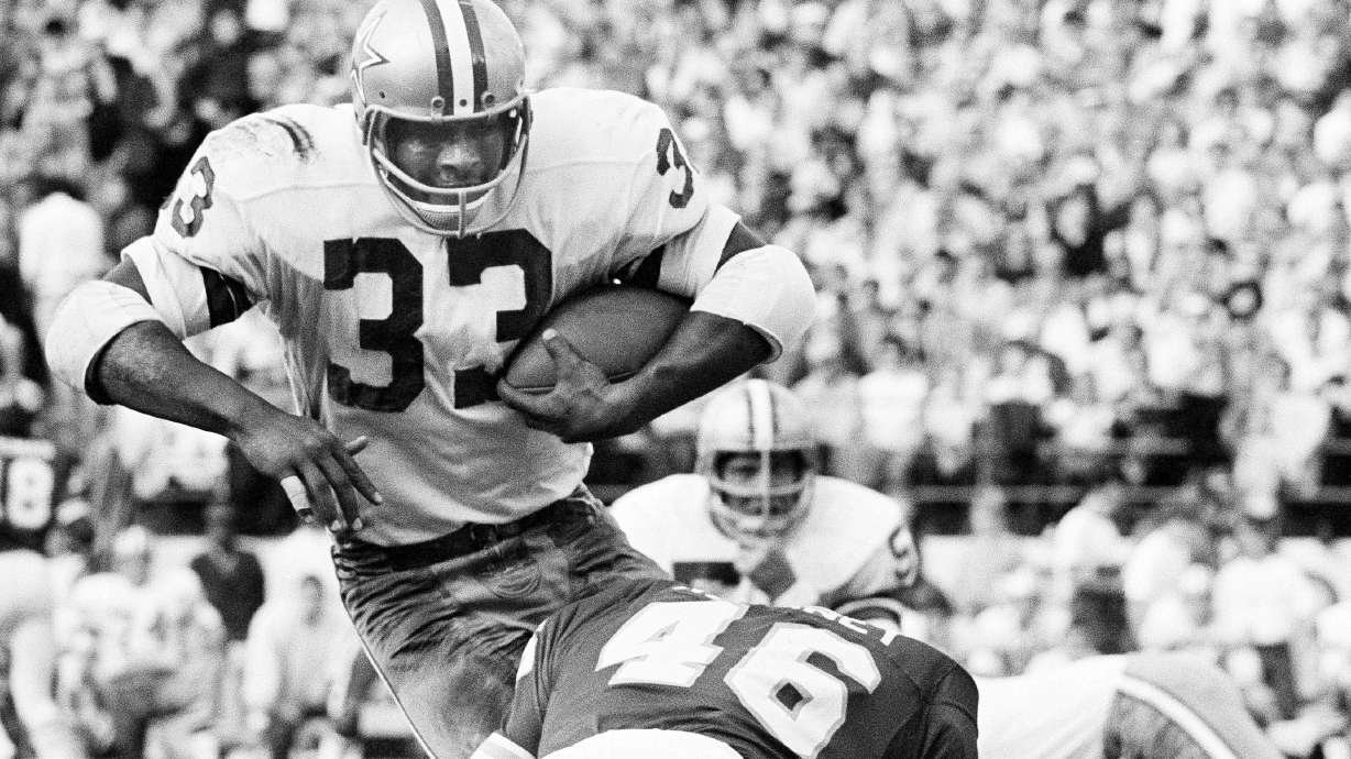 FILE - Dallas Cowboys' Duane Thomas (33) gains yardage and a first down as is brought down by Kansas City Chiefs' Jim Kearney (46) during the second quarter of an NFL football game at Municipal Stadium at Kansas City, Mo., Oct. 25, 1970.