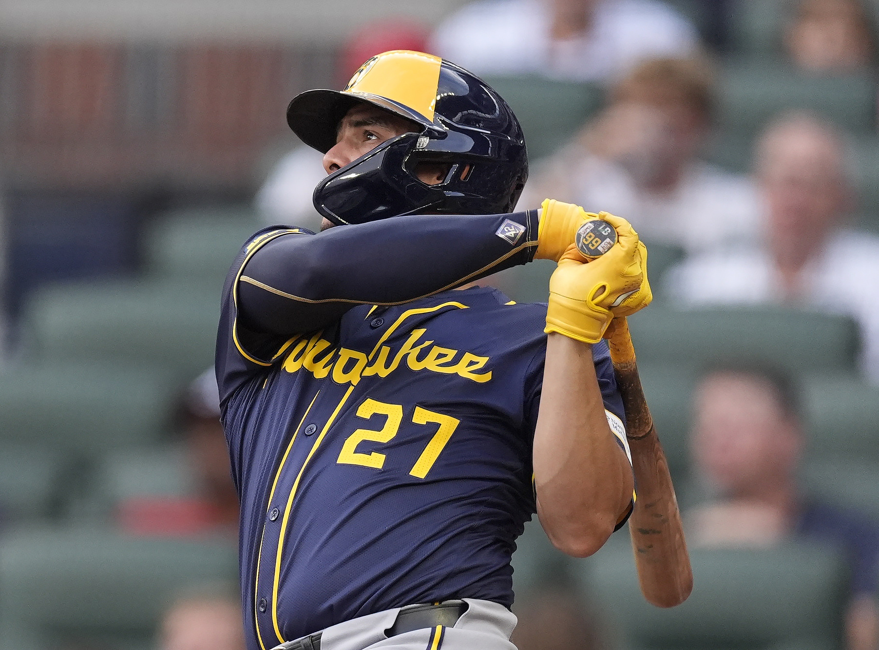 Milwaukee Brewers' Willy Adames follows through on a two-run home run in the first inning of a baseball game against the Atlanta Braves, Tuesday, Aug. 6, 2024, in Atlanta. 