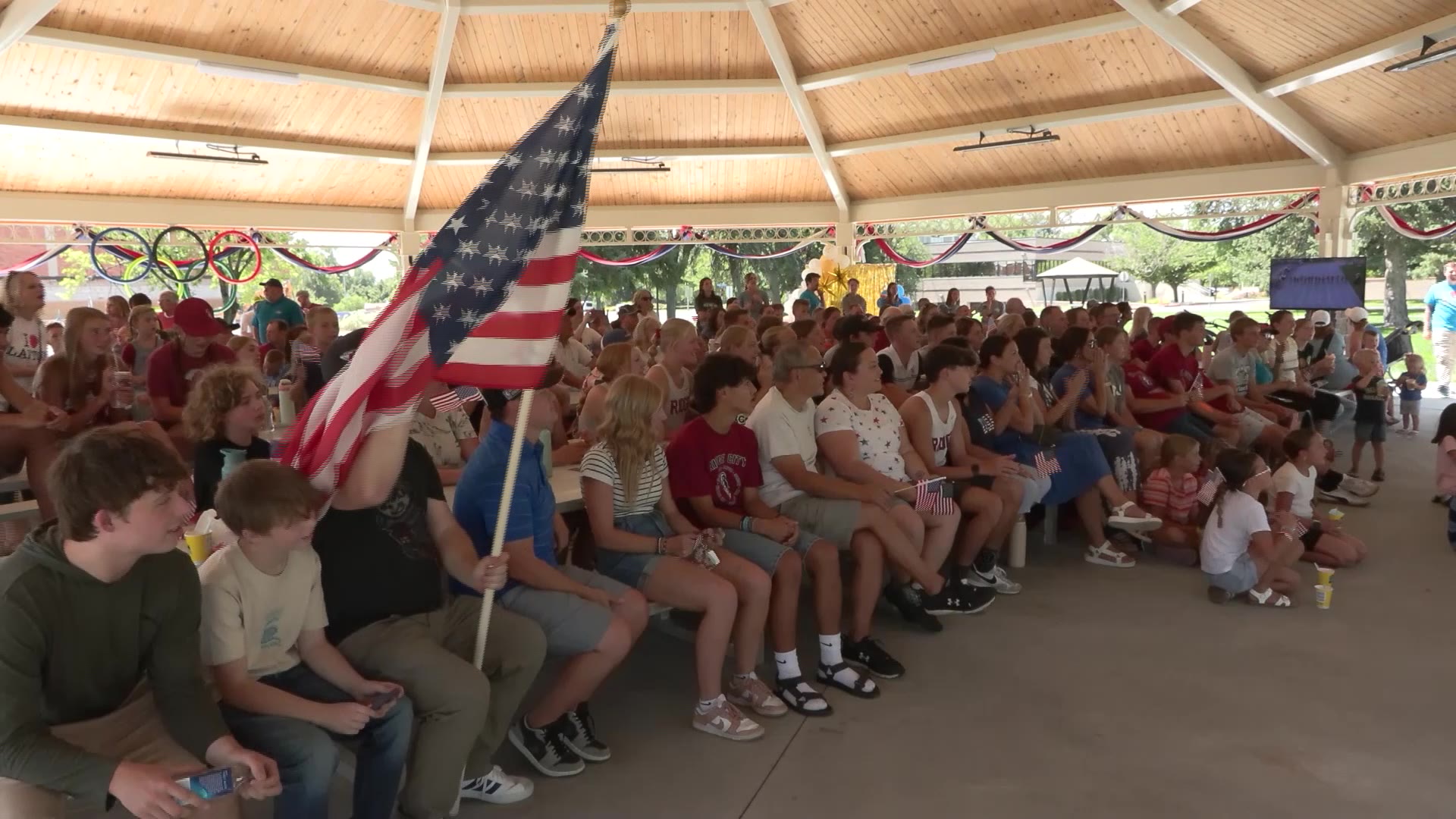 Community gathers to watch hometown hero compete in Olympics