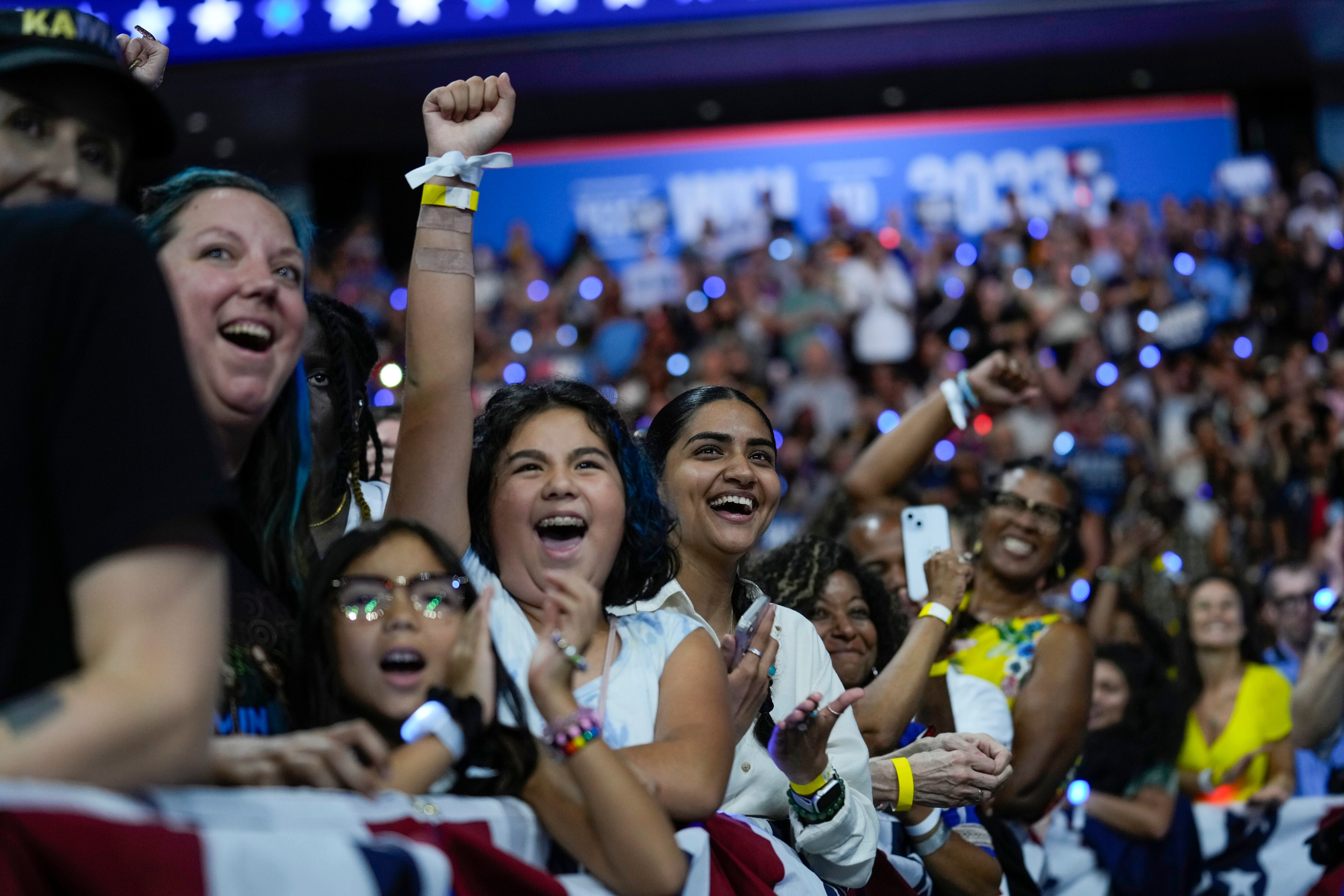 Supporters cheer as Democratic presidential nominee Vice President Kamala Harris and her running mate Minnesota Gov. Tim Walz arrive at a campaign rally in Philadelphia, Pa., Tuesday.