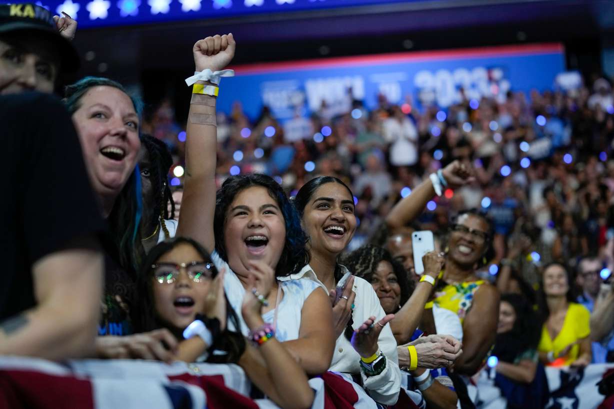 Supporters cheer as Democratic presidential nominee Vice President Kamala Harris and her running mate Minnesota Gov. Tim Walz arrive at a campaign rally in Philadelphia, Pa., Tuesday.