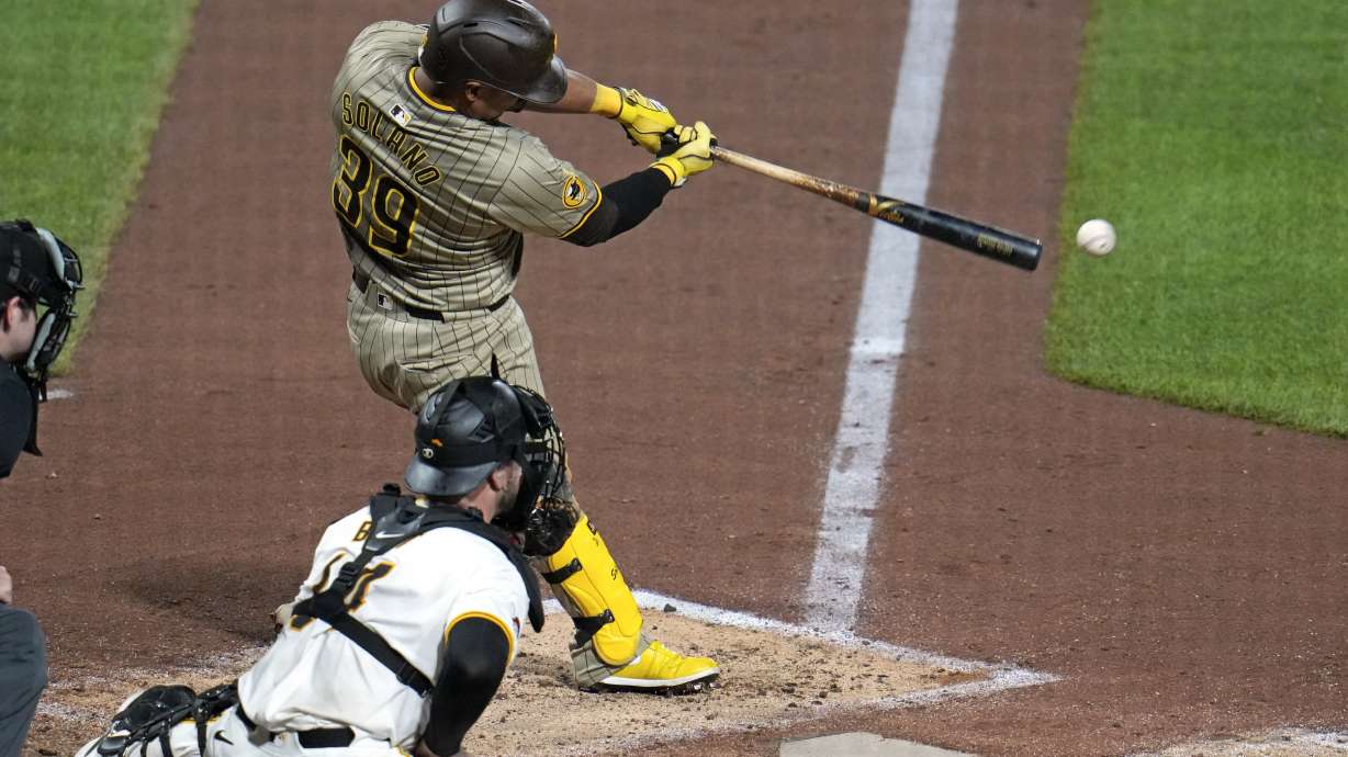 San Diego Padres' Donovan Solano (39) singles off Pittsburgh Pirates relief pitcher Kyle Nicolas, driving in two runs, during the fifth inning of a baseball game in Pittsburgh, Tuesday, Aug. 6, 2024.