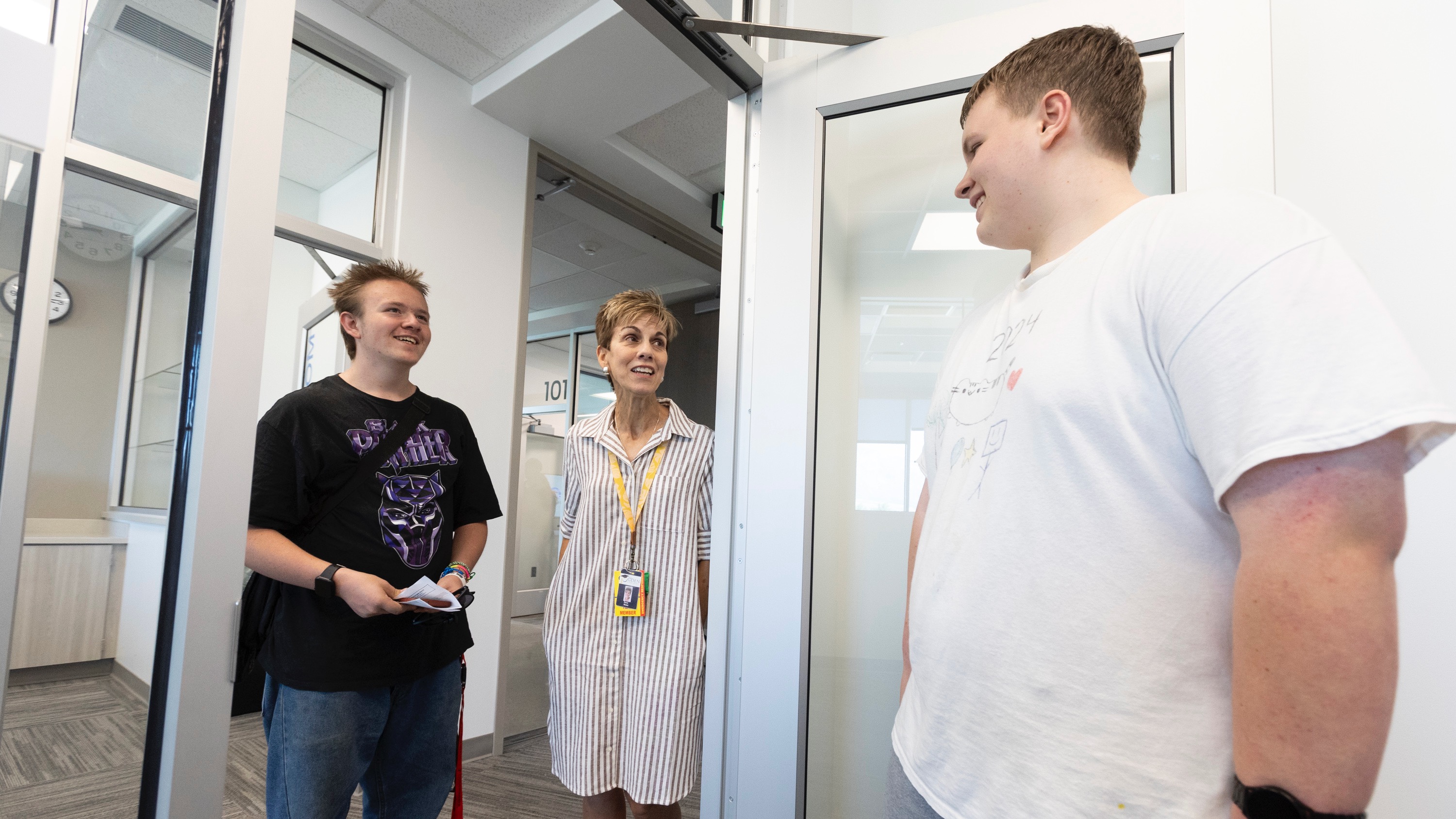 Ogden Technical High School Principal Dana Nolan, center, talks with incoming fall students Darick Jones, 16, left, and James Fedor, 16, right, during a public open house event to celebrate the opening of Ogden Technical High School in Ogden on Tuesday, Aug. 6, 2024.
