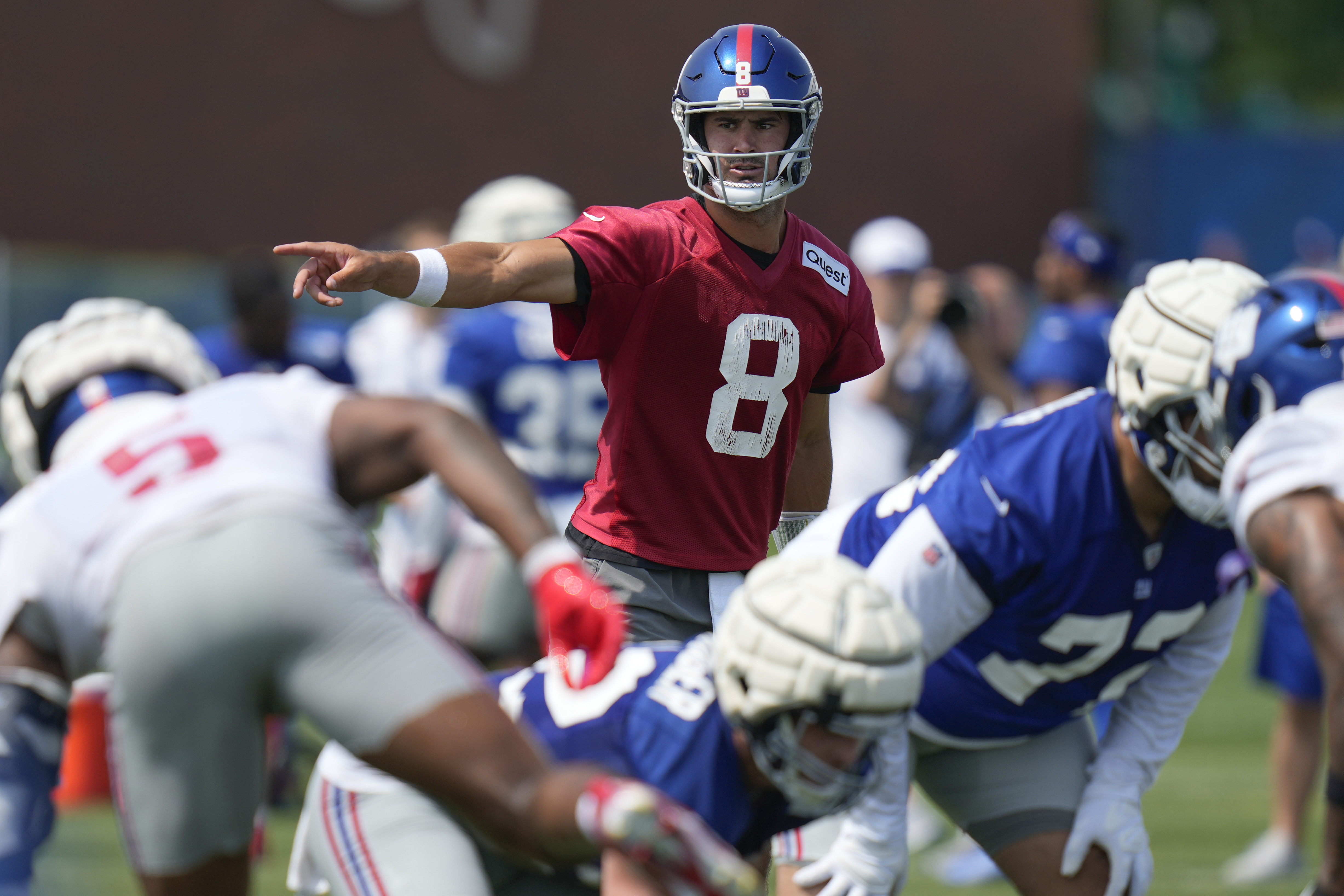 New York Giants quarterback Daniel Jones participates in a drill during the NFL football team's training camp in East Rutherford, N.J., Sunday, July 28, 2024. 
