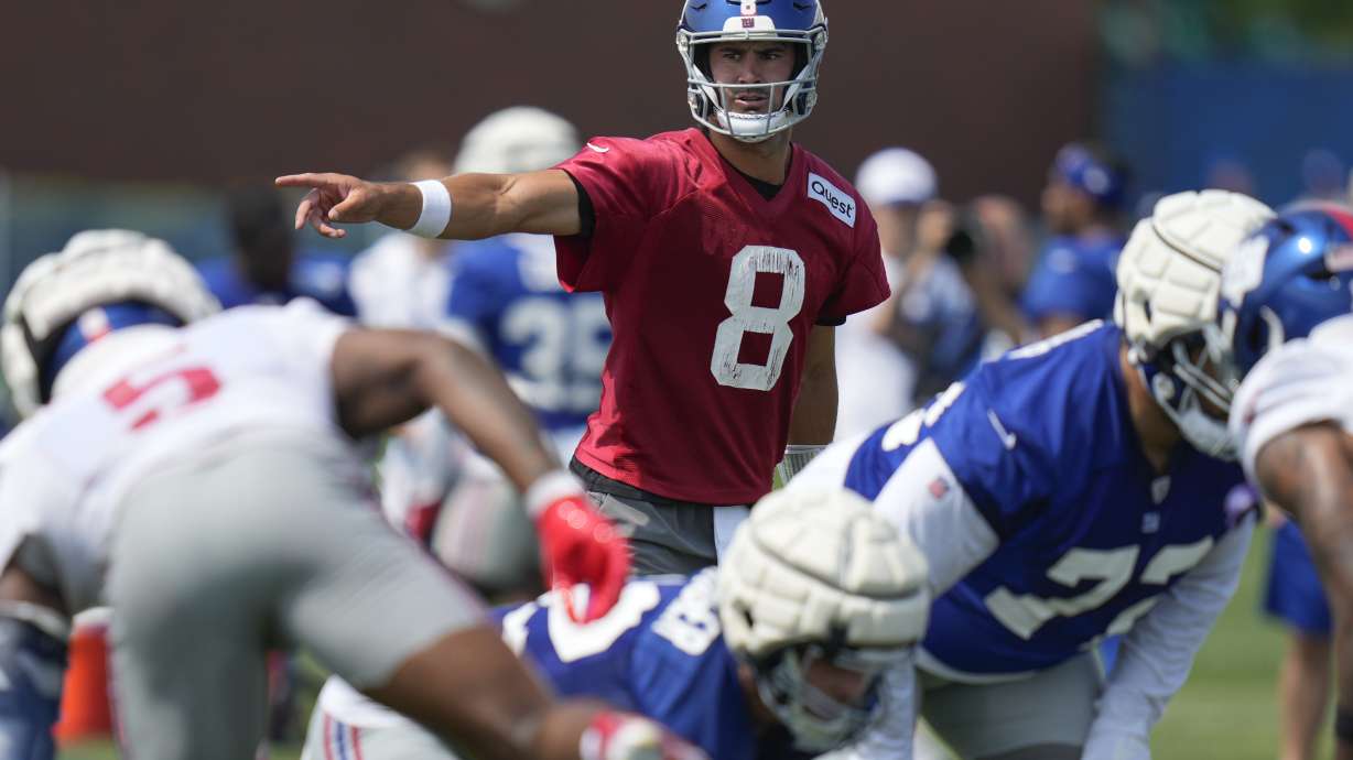 New York Giants quarterback Daniel Jones participates in a drill during the NFL football team's training camp in East Rutherford, N.J., Sunday, July 28, 2024.