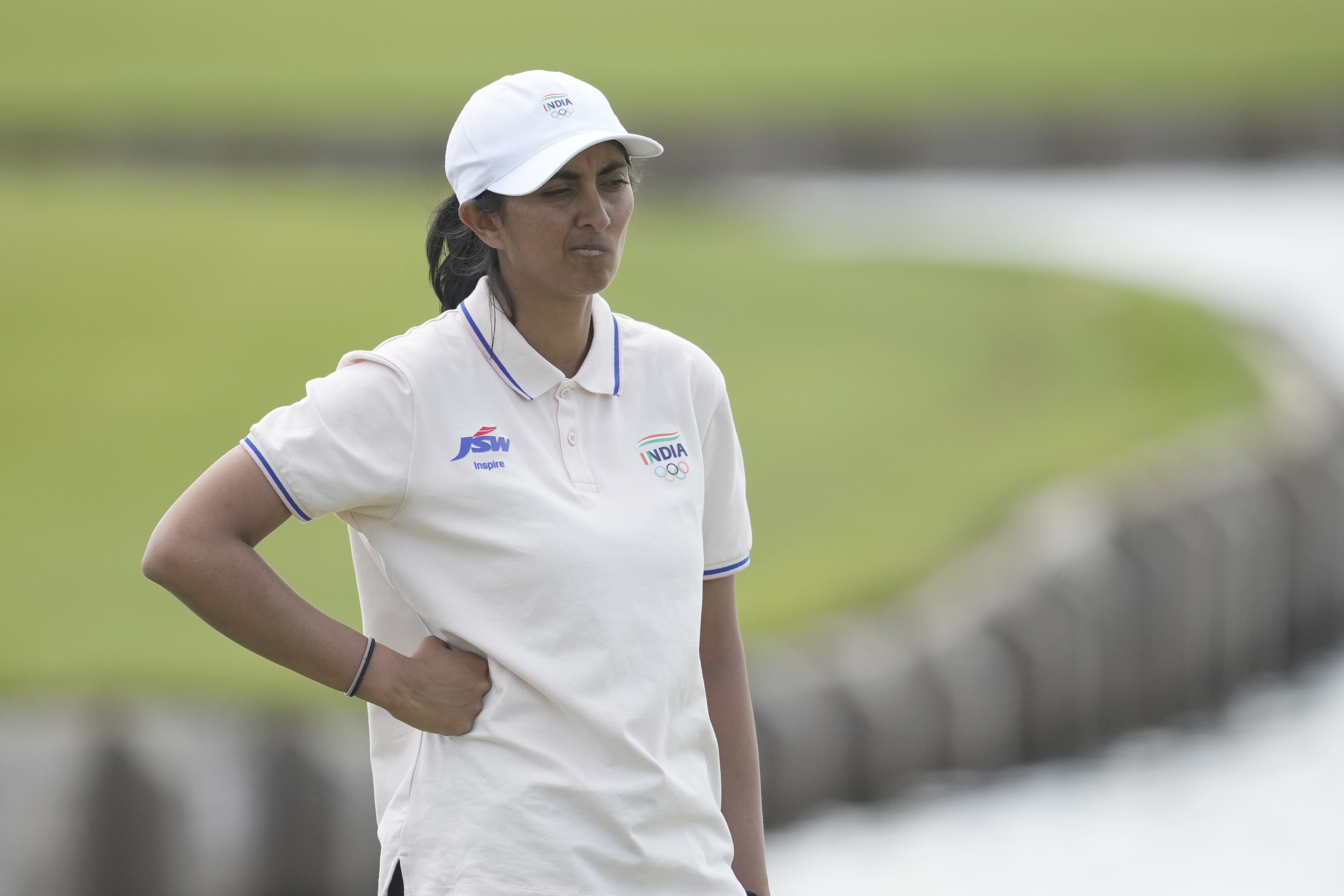 Aditi Ashok, of India, reacts after a double bogey on the 18th green during the first round of the women's golf event at the 2024 Summer Olympics, Wednesday, Aug. 7, 2024, at Le Golf National, in Saint-Quentin-en-Yvelines, France. 