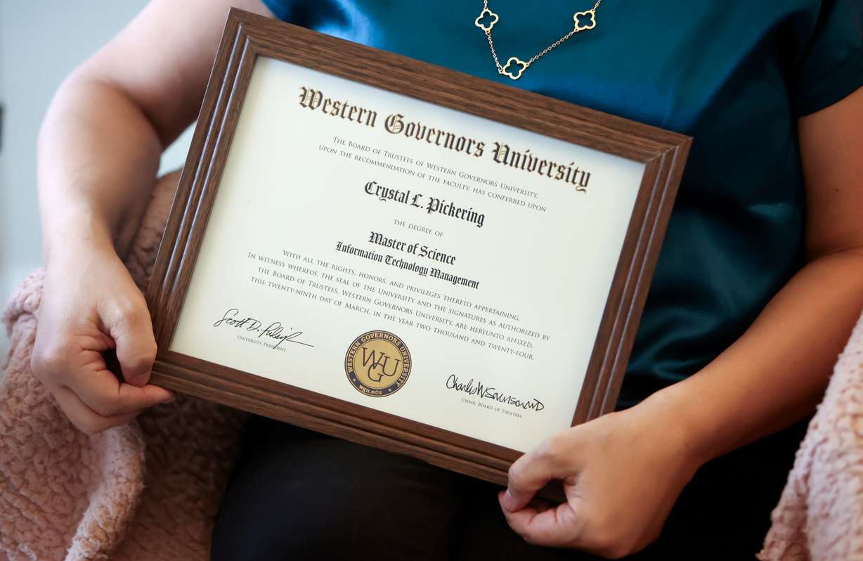 Crystal Pickering, a recent Master of Science graduate of Western Governors University poses for a portrait with her diploma in Herriman on Tuesday.