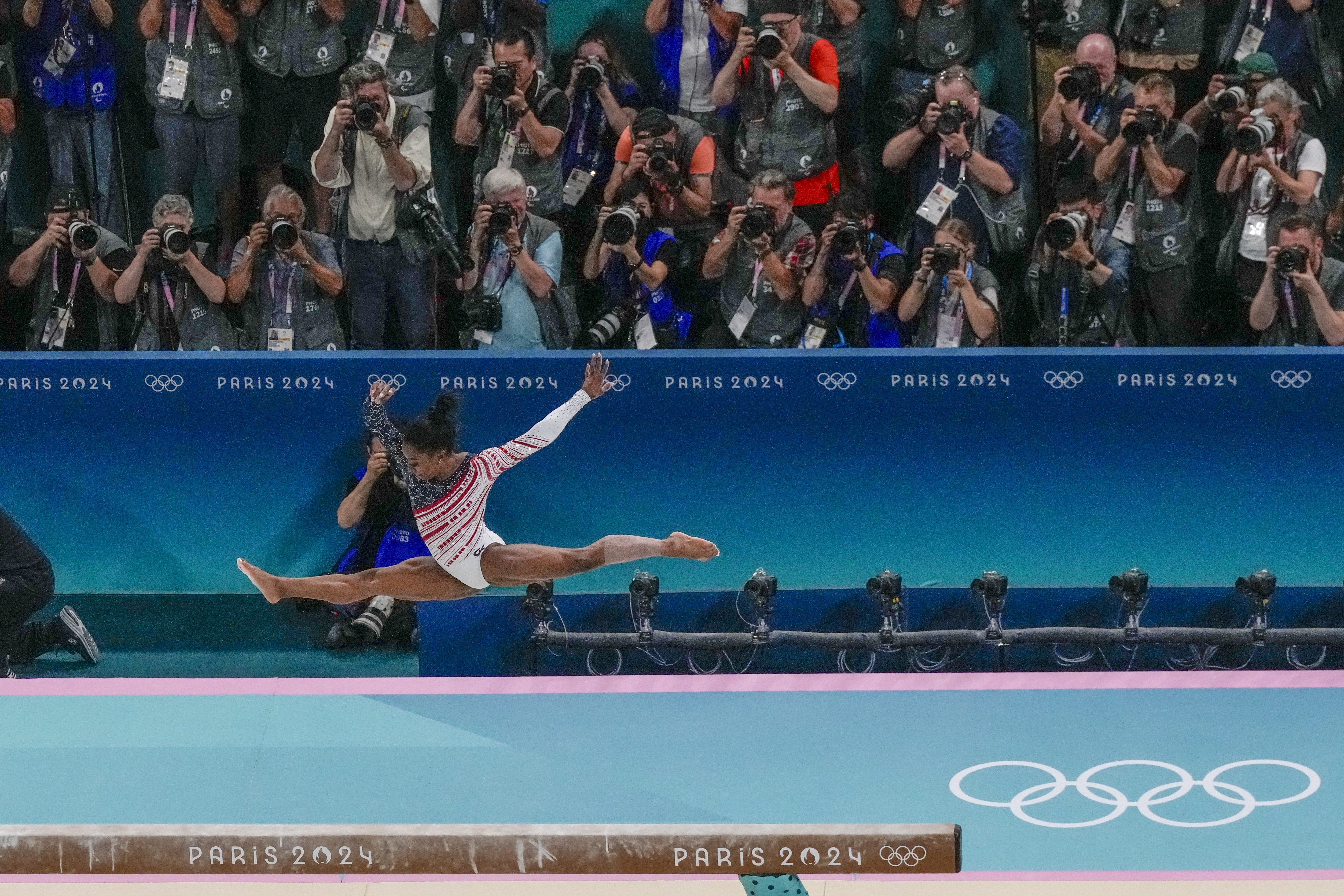 Simone Biles, of United States, performs on the beam during the women's artistic gymnastics team finals at the 2024 Summer Olympics, Tuesday, July 30, 2024, in Paris, France. 