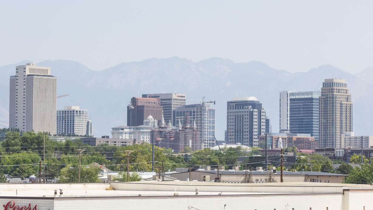 Haze from wildfire smoke hangs over the skyline of downtown Salt Lake City on Friday. The smoky skies are forecast to return Wednesday and linger in Utah's northern half through at least Friday.