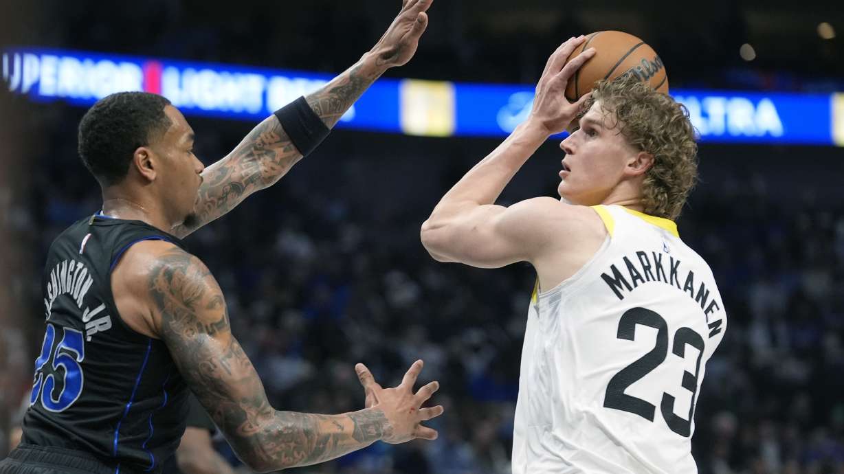 FILE - Utah Jazz forward Lauri Markkanen (23) looks for an opening against Dallas Mavericks defender P.J. Washington (25) during an NBA basketball game in Dallas, March 21, 2024.