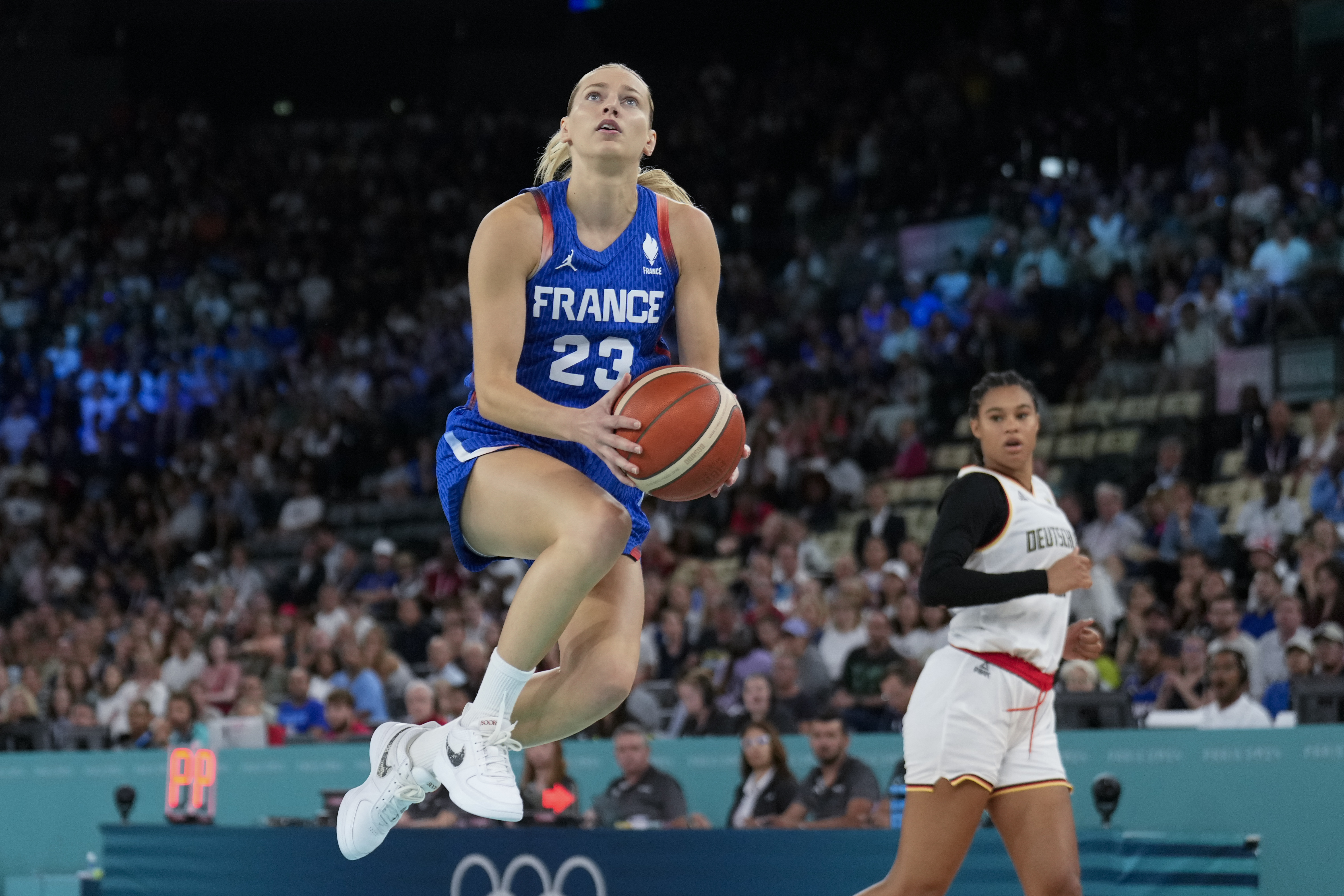 Marine Johannes (23), of France, shoots against Germany during a women's quarterfinal game at Bercy Arena at the 2024 Summer Olympics, Wednesday, Aug. 7, 2024, in Paris, France.
