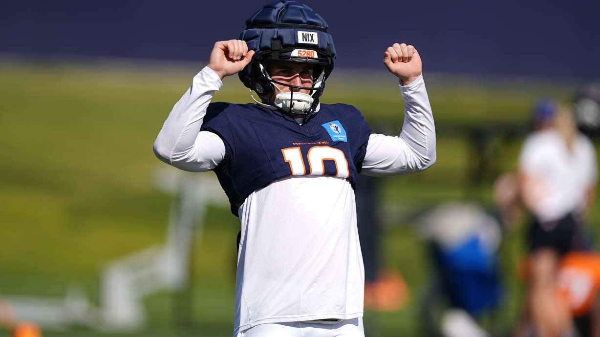 Denver Broncos quarterback Bo Nix takes part in drills during an NFL football training camp at the team's headquarters Wednesday, Aug. 7, 2024, in Centennial, Colo.