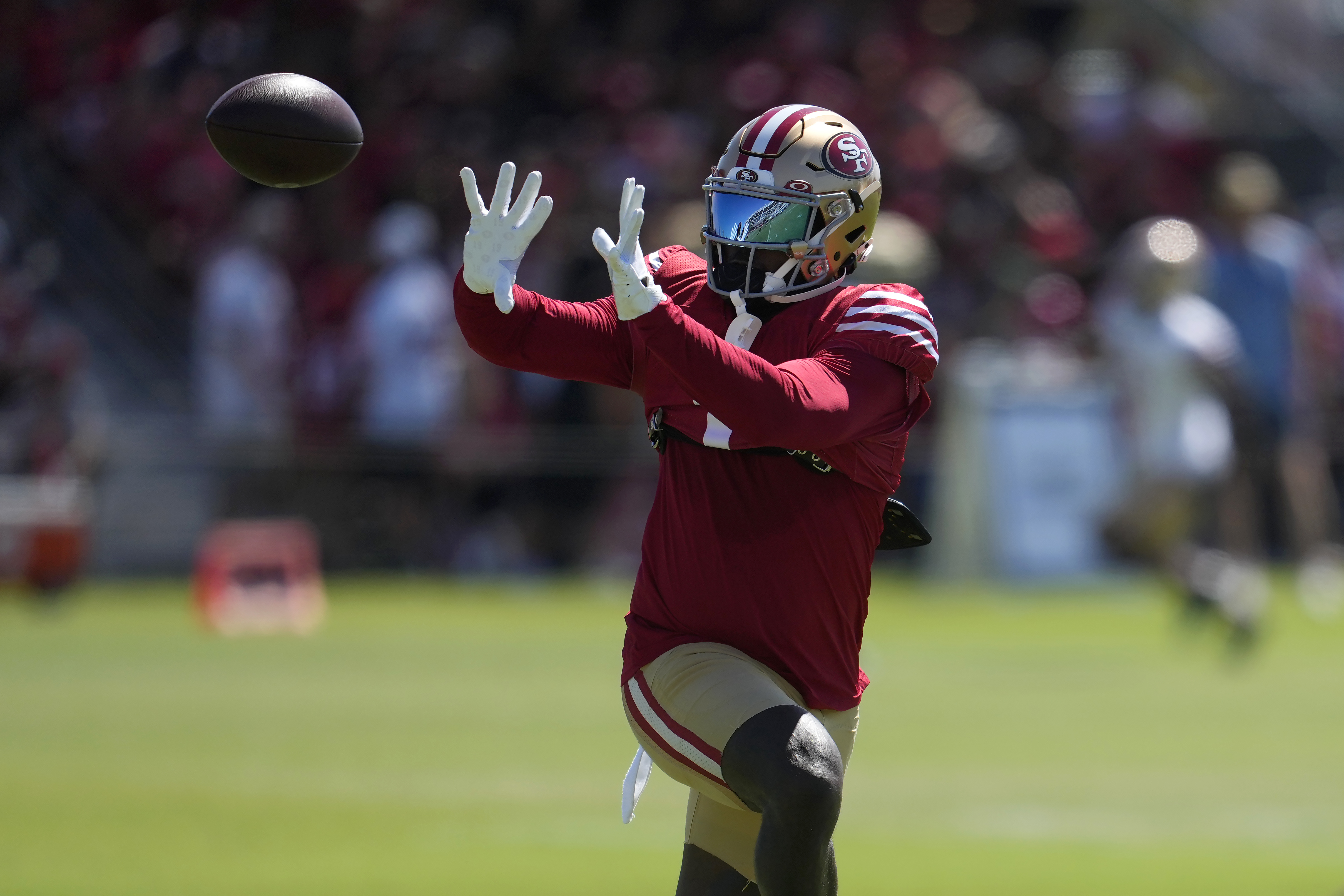 San Francisco 49ers wide receiver Deebo Samuel Sr. catches a pass during NFL football training camp in Santa Clara, Calif., Wednesday, July 31, 2024.