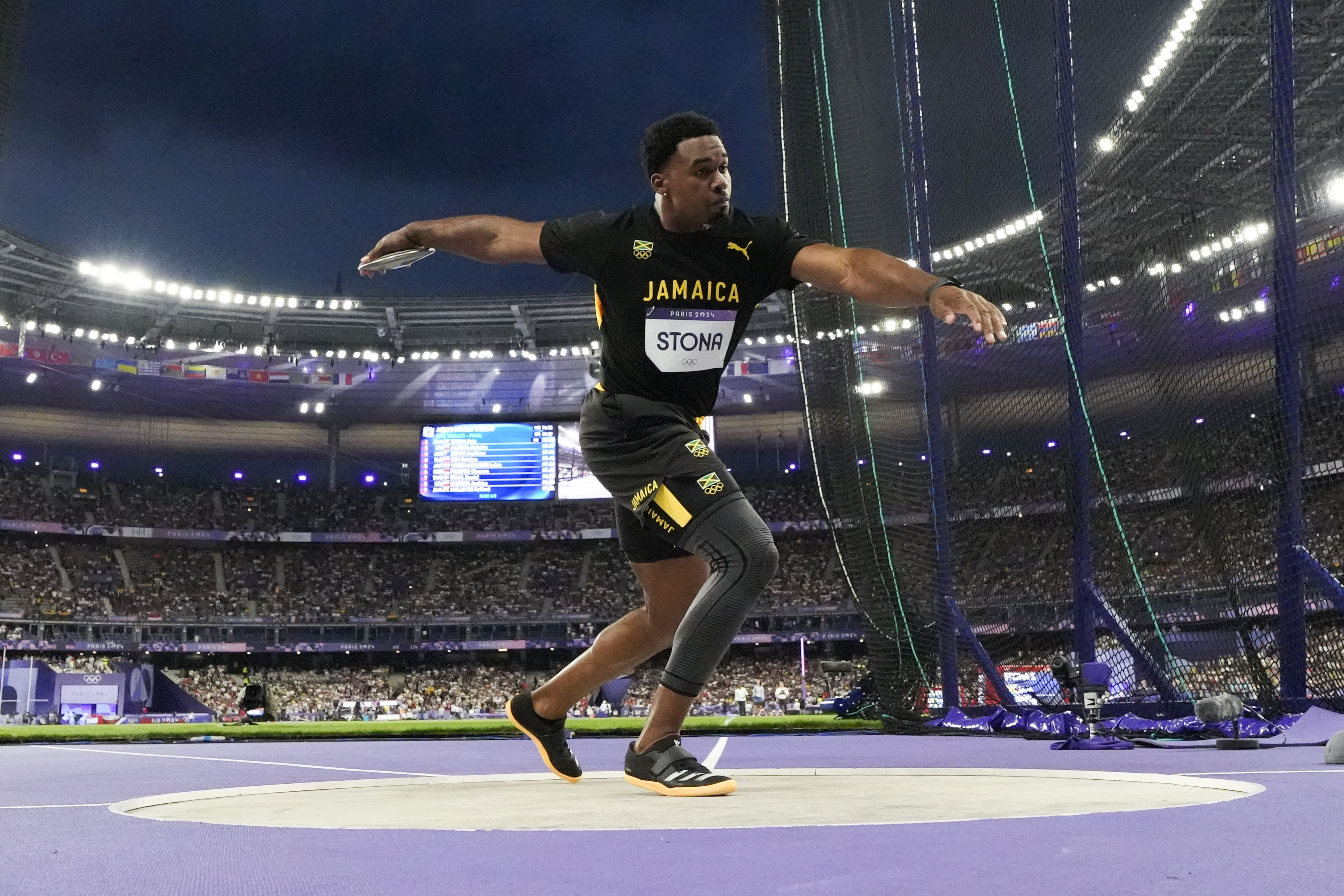 Roje Stona, of Jamaica, competes during the men's discus throw final at the 2024 Summer Olympics, Wednesday, Aug. 7, 2024, in Saint-Denis, France. 