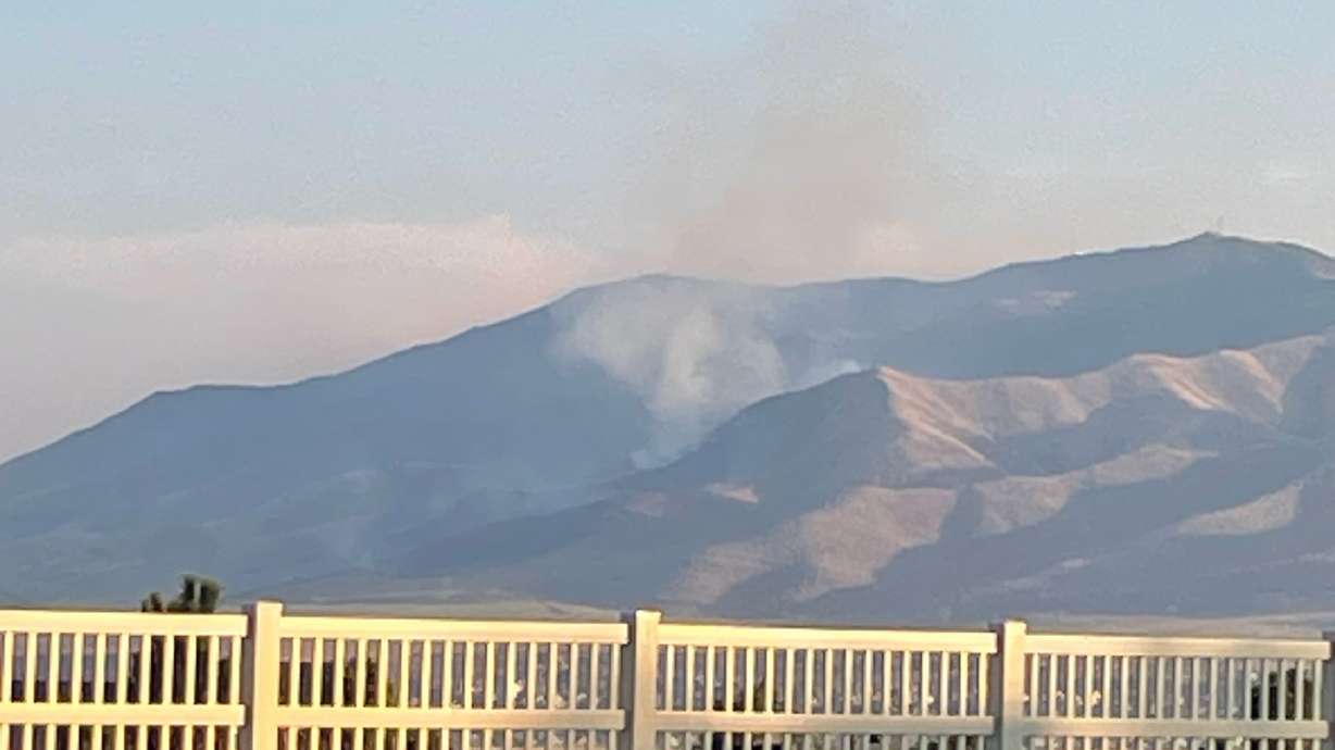 A wildfire blazes across 200 acres near Saratoga Springs in Utah County. Residents can see smoke from their homes.
