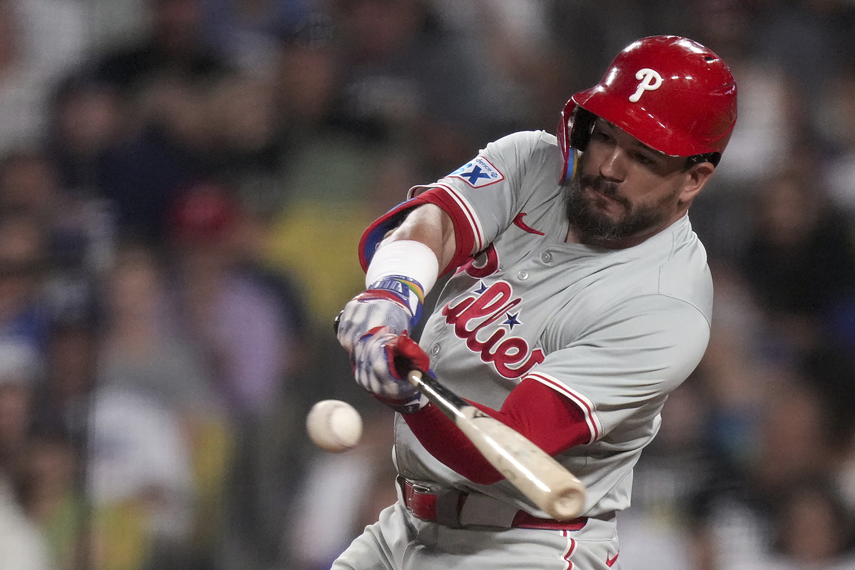 Philadelphia Phillies designated hitter Kyle Schwarber hits a home run during the sixth inning of a baseball game against Los Angeles Dodgers in Los Angeles, Wednesday, Aug. 7, 2024. 
