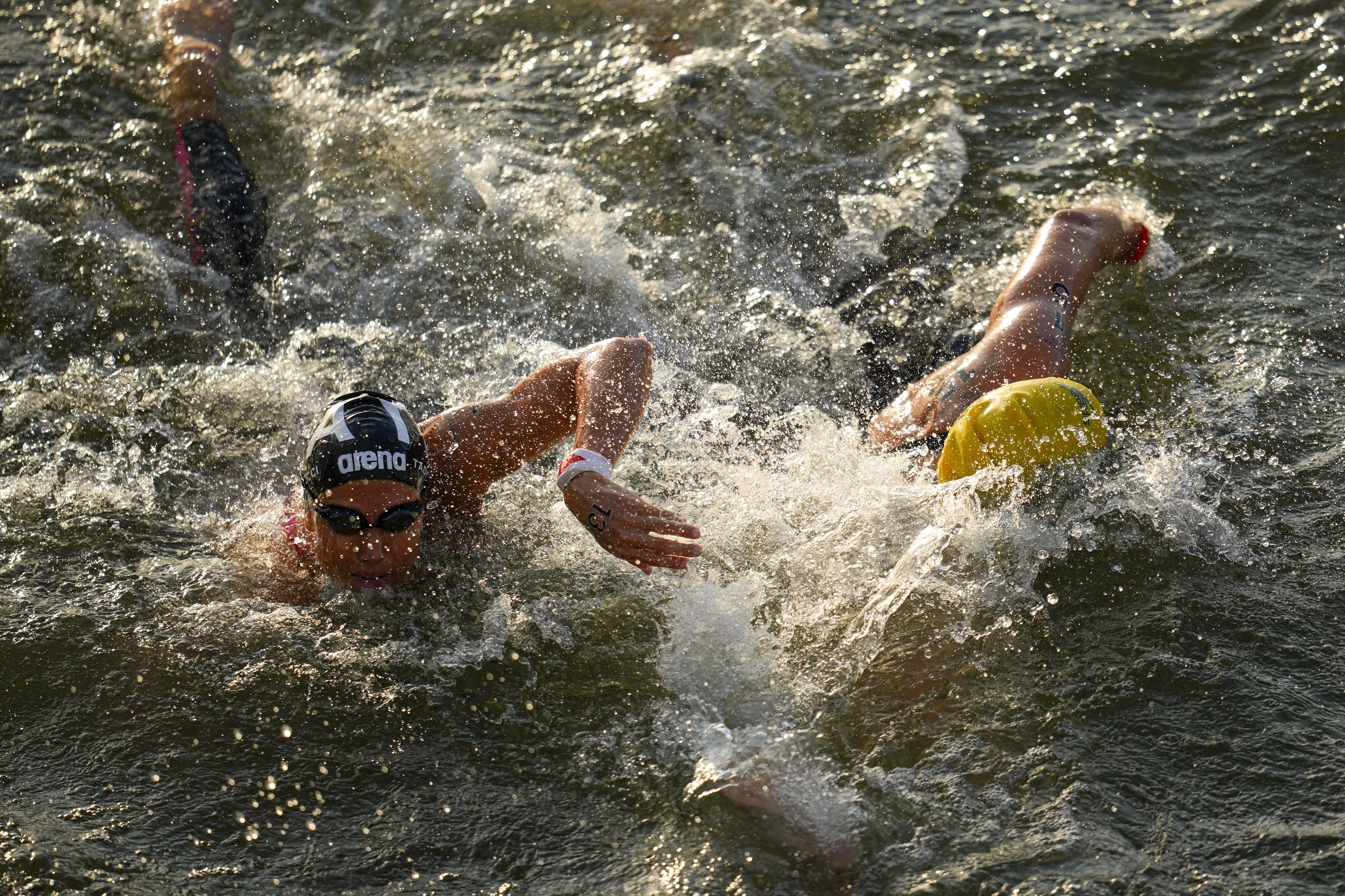 Italy's Ginevra Taddeucci (left) competes during the marathon swimming women's 10km competition at the 2024 Summer Olympics, Thursday, Aug. 8, 2024, in Paris, France. 