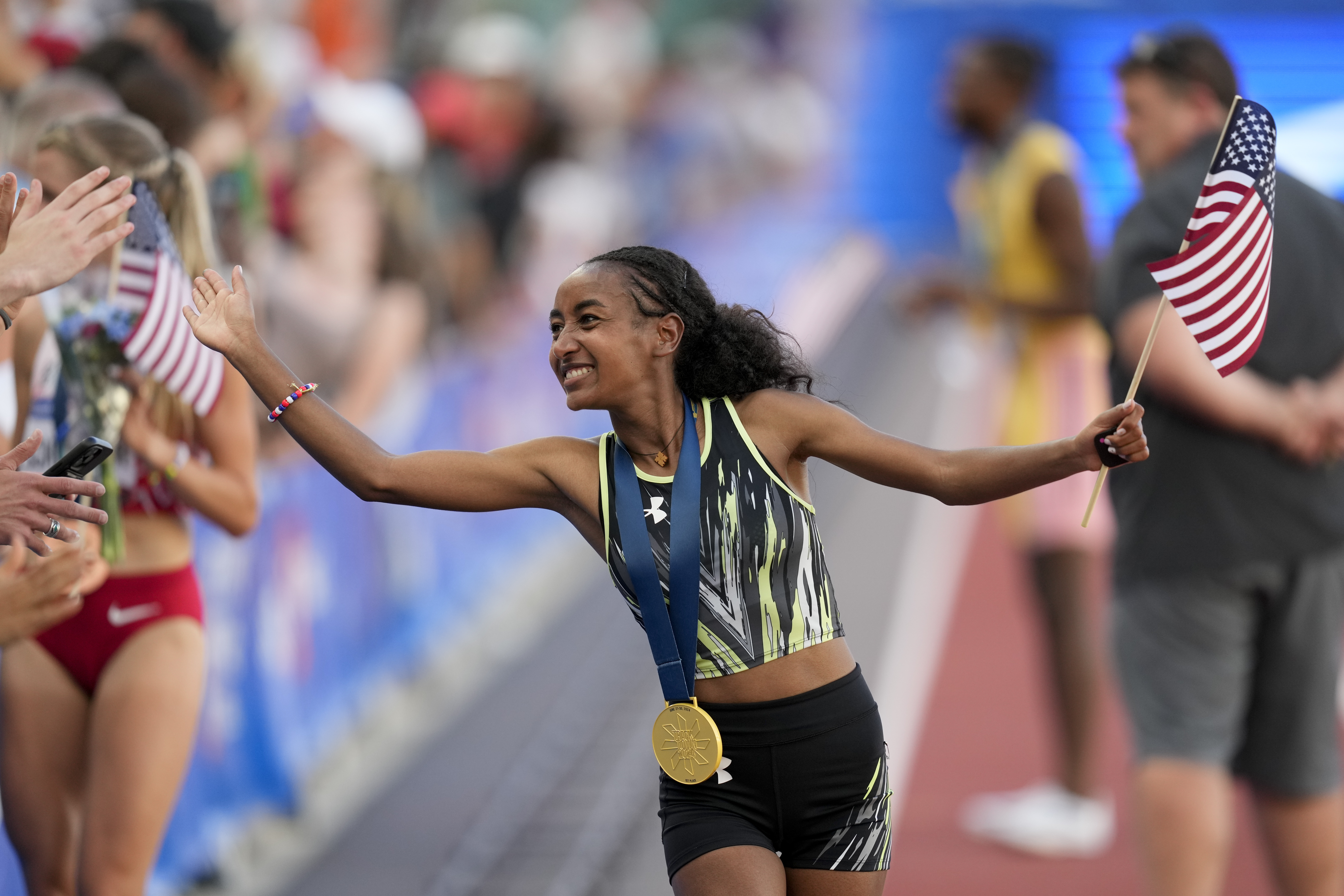 FILE - Weini Kelati celebrates after winning the women's 10,000-meter final during the U.S. Track and Field Olympic Team Trials, June 29, 2024, in Eugene, Ore.