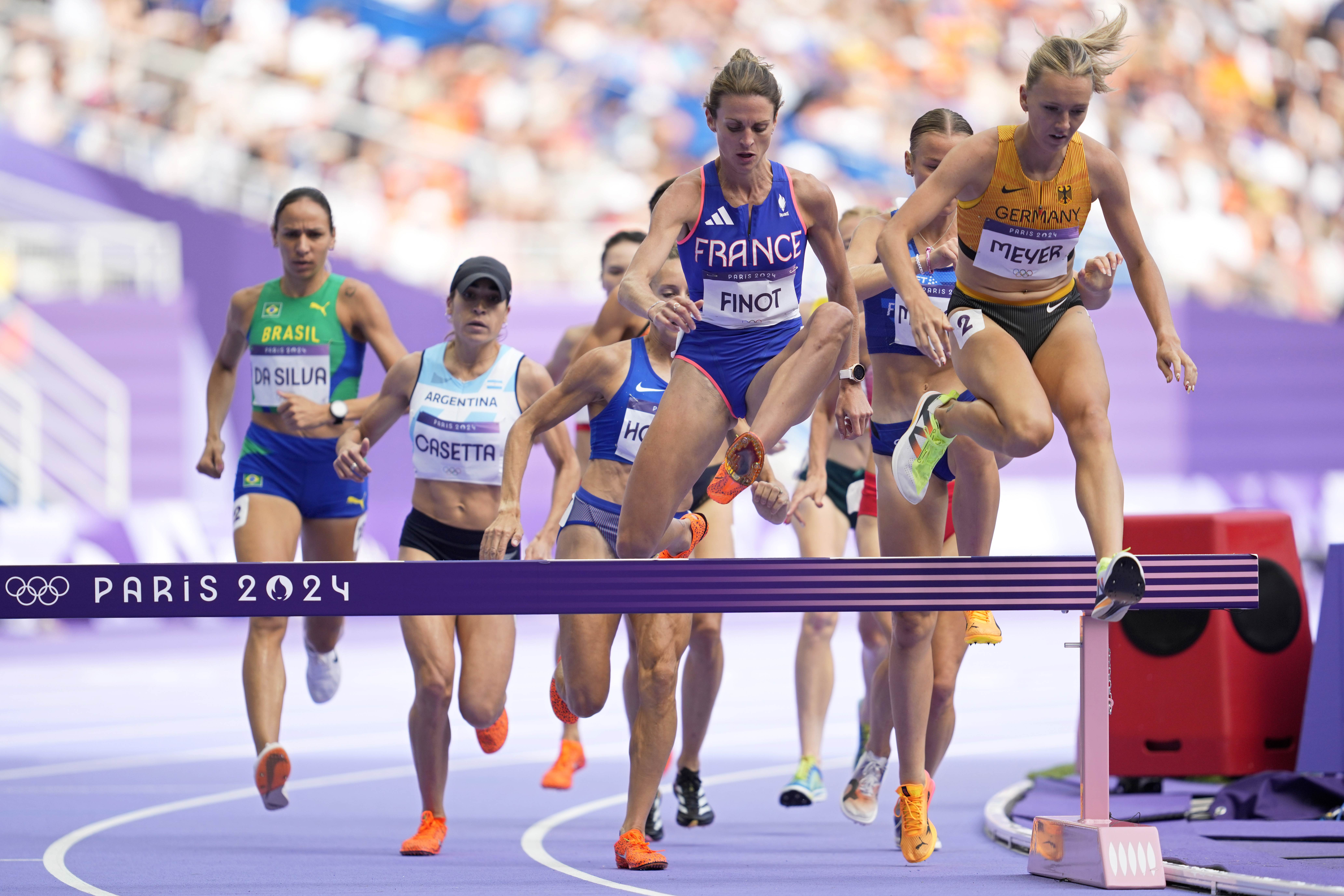 Alice Finot, of France, and Lea Meyer, of Germany, compete in a women's 3000 meters steeplechase round 1 heat at the 2024 Summer Olympics, Sunday, Aug. 4, 2024, in Saint-Denis, France. 
