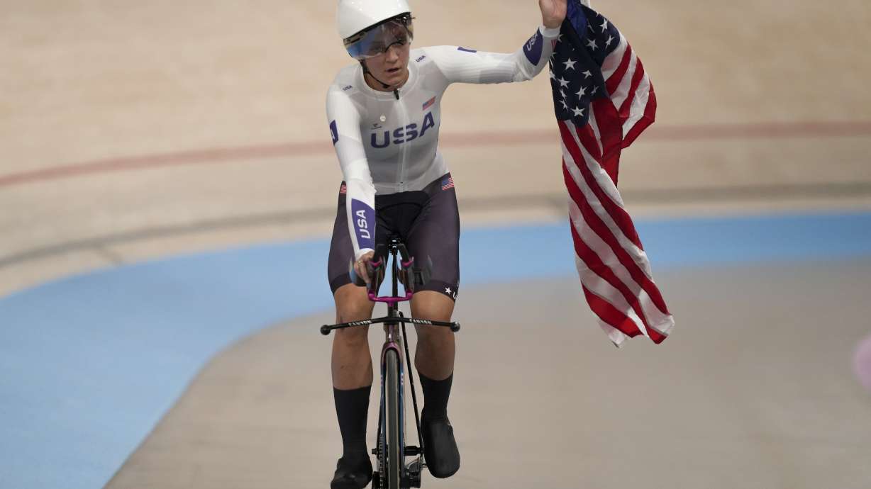 Chloe Dygert of the United States celebrates winning the gold medal in the women's team pursuit event, at the Summer Olympics, Wednesday, Aug. 7, 2024, in Paris, France.