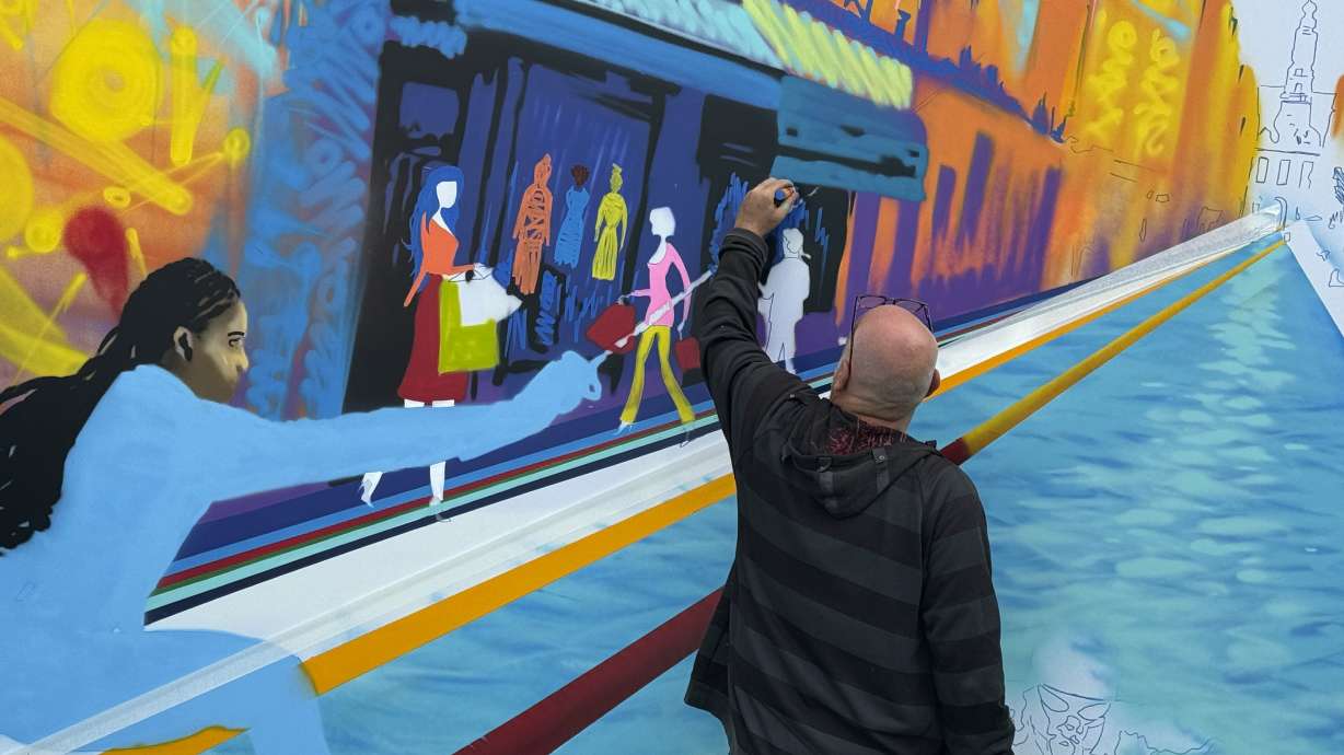 Street artist Marko93 works on a piece during a live artistic performance at City Hall, during the 2024 Summer Olympics, Wednesday, July 31, 2024, in Paris, France.