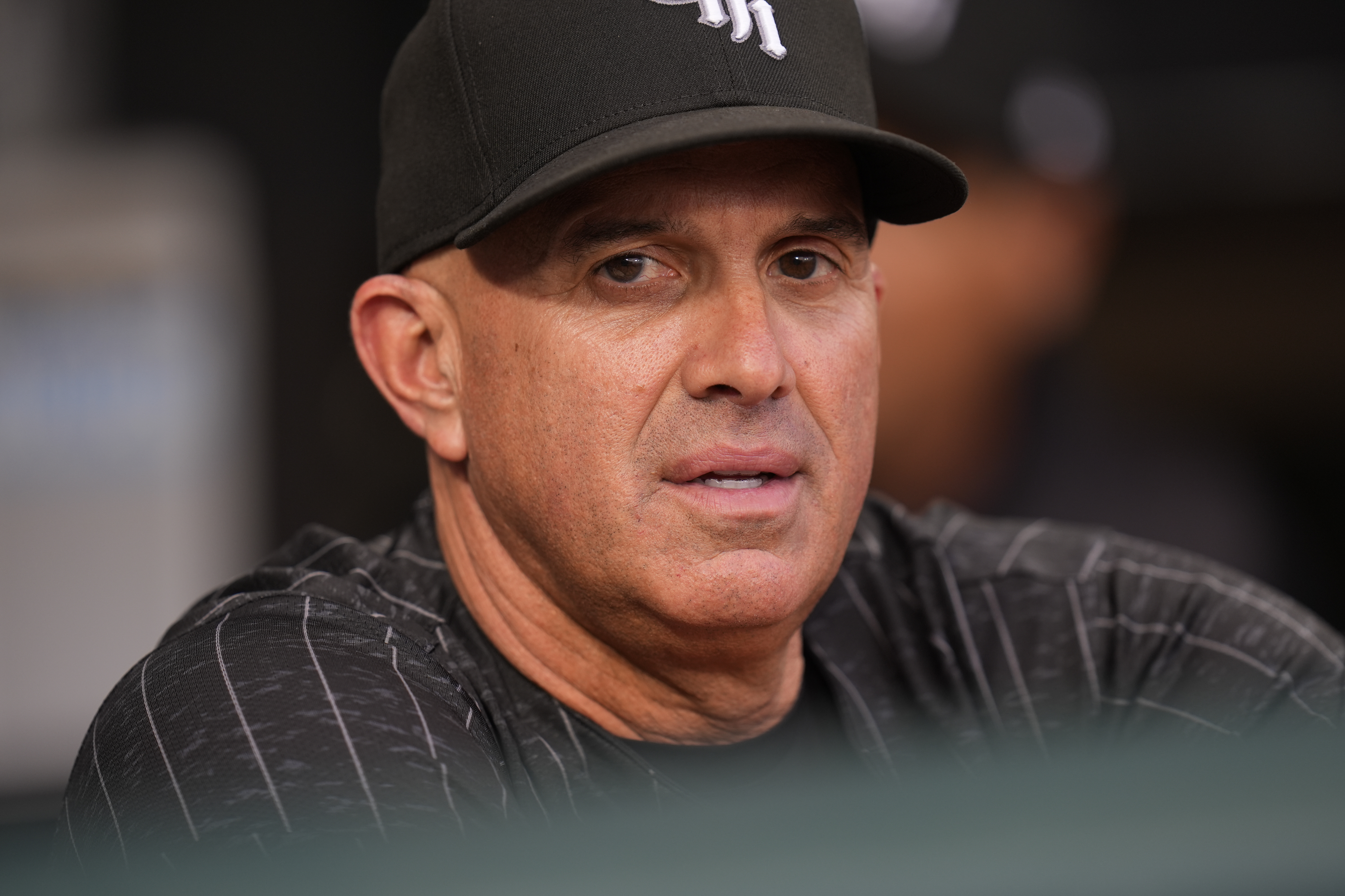 Chicago White Sox manager Pedro Grifol stands in the dugout before a baseball game against the Kansas City Royals, Monday, July 29, 2024, in Chicago.