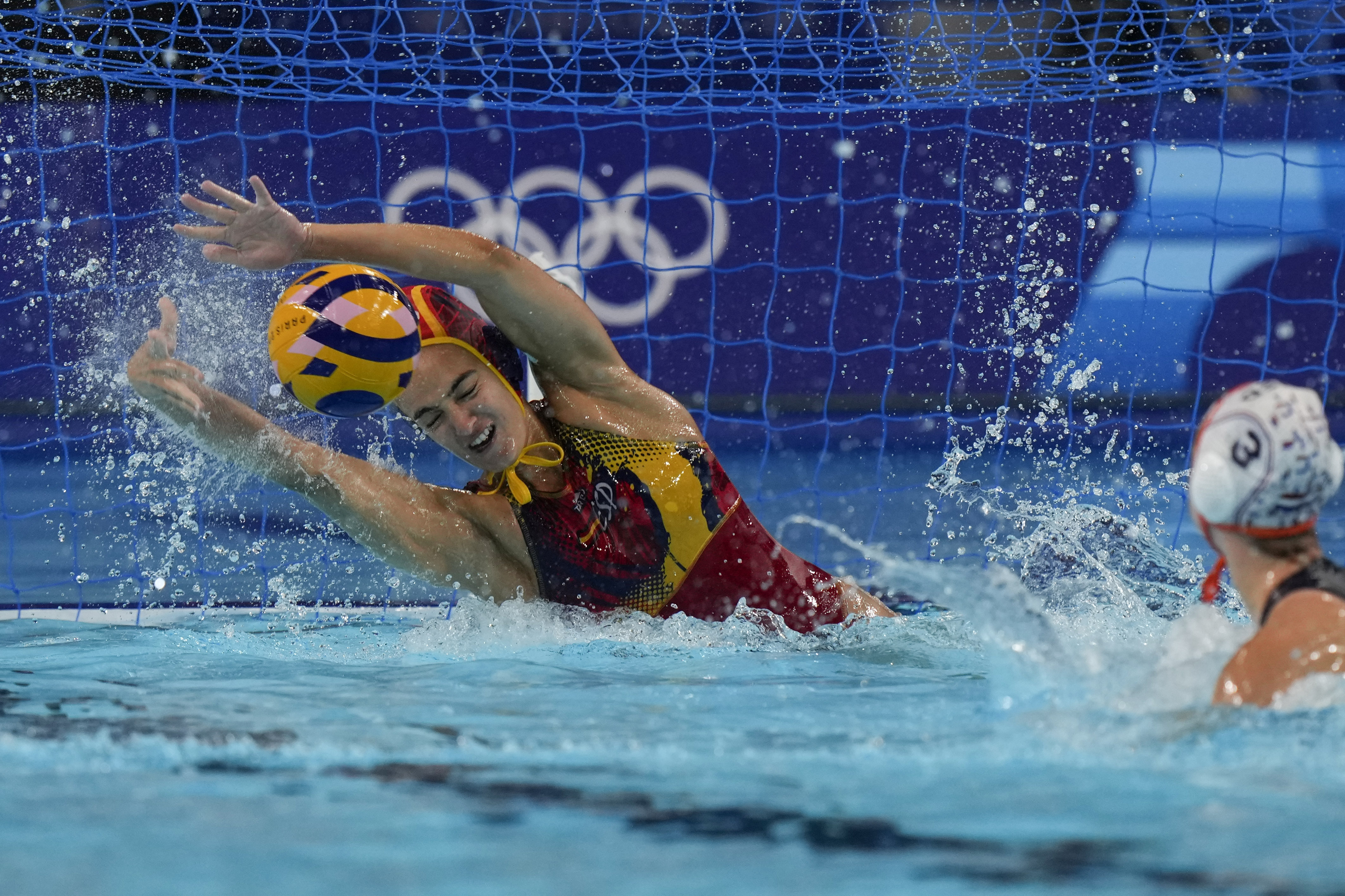 Spain's Martina Terre saves a penalty by Netherland's Brigitte Sleeking during penalties shoot out of a women's Water Polo semifinal match between Netherlands and Spain at the 2024 Summer Olympics, Thursday, Aug. 8, 2024, in Paris, France. 