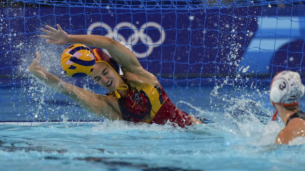 Spain's Martina Terre saves a penalty by Netherland's Brigitte Sleeking during penalties shoot out of a women's Water Polo semifinal match between Netherlands and Spain at the 2024 Summer Olympics, Thursday, Aug. 8, 2024, in Paris, France.