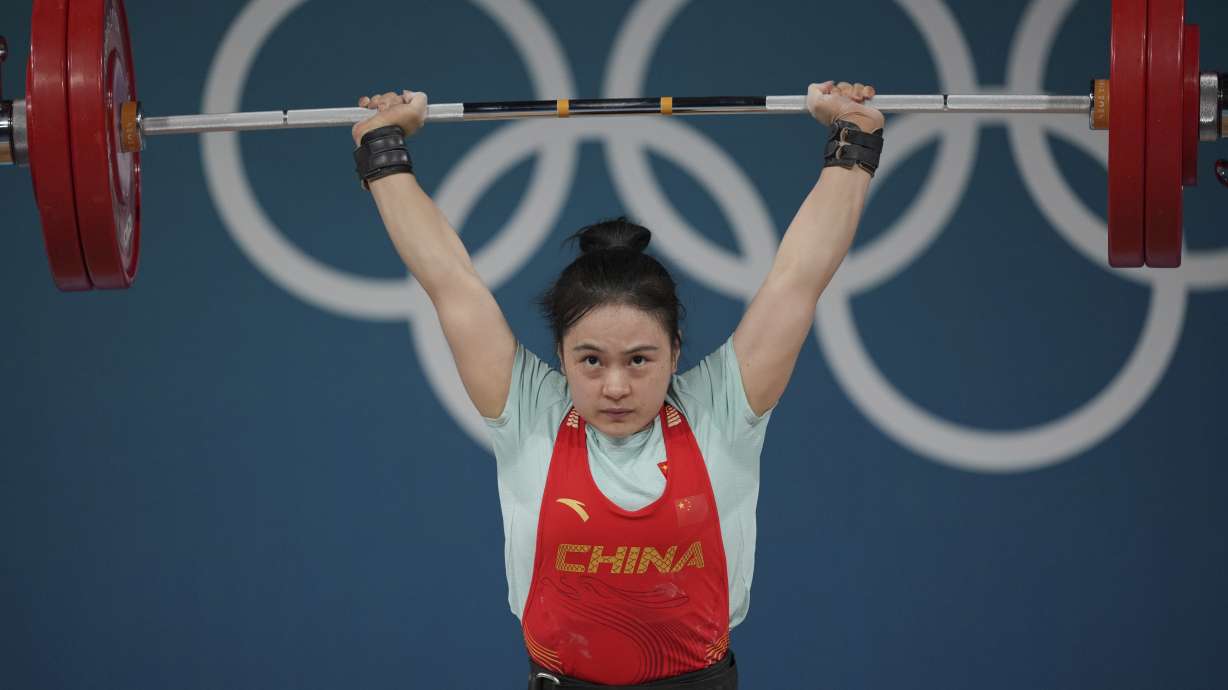 Luo Shifang of China competes during the women's 59kg weightlifting event at the 2024 Summer Olympics, Thursday, Aug. 8, 2024, in Paris, France.