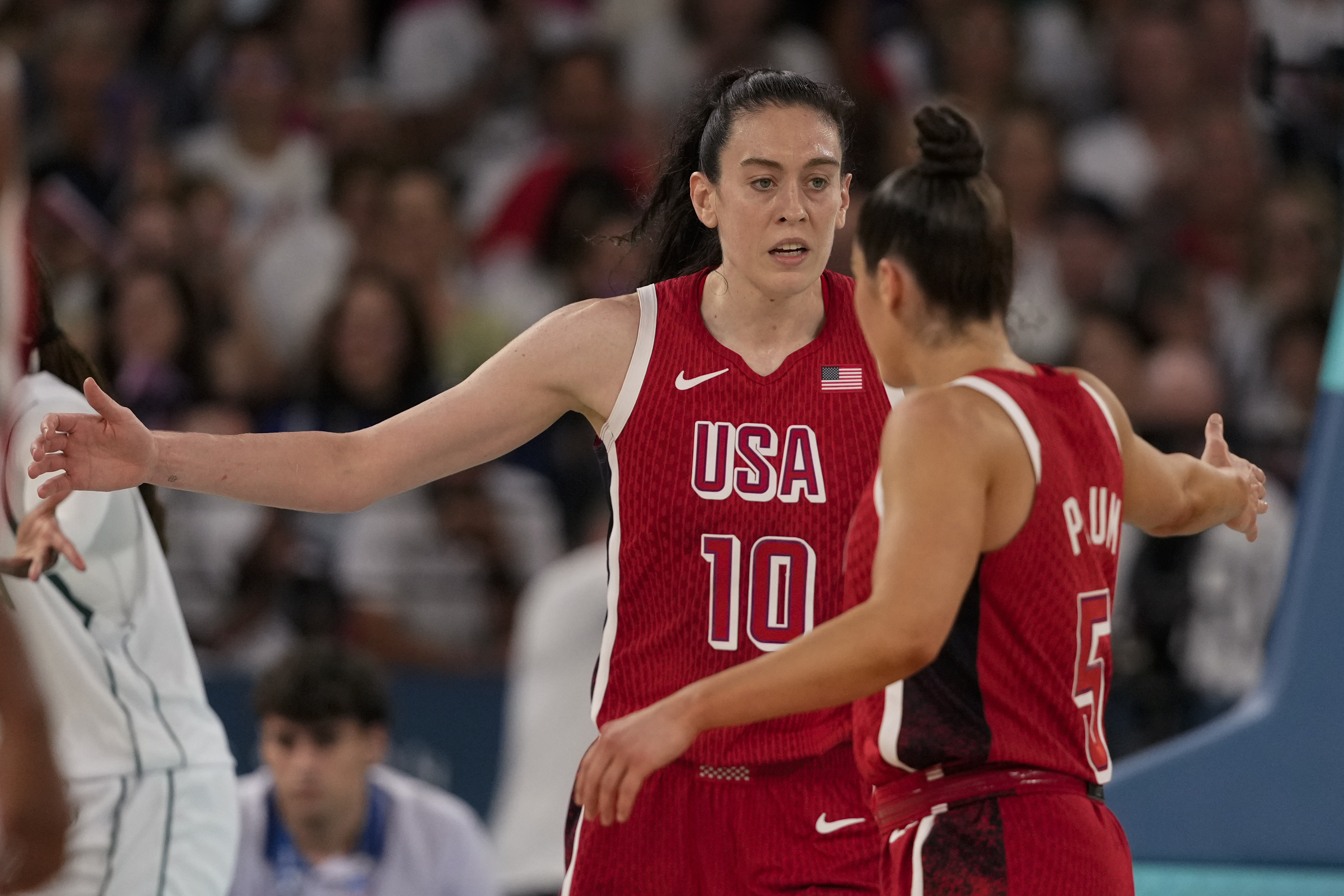 United States' Breanna Stewart (10) celebrates with Kelsey Plum (5) after a basket against Nigeria during a women's quarterfinal game at Bercy Arena at the 2024 Summer Olympics, Wednesday, Aug. 7, 2024, in Paris, France. 