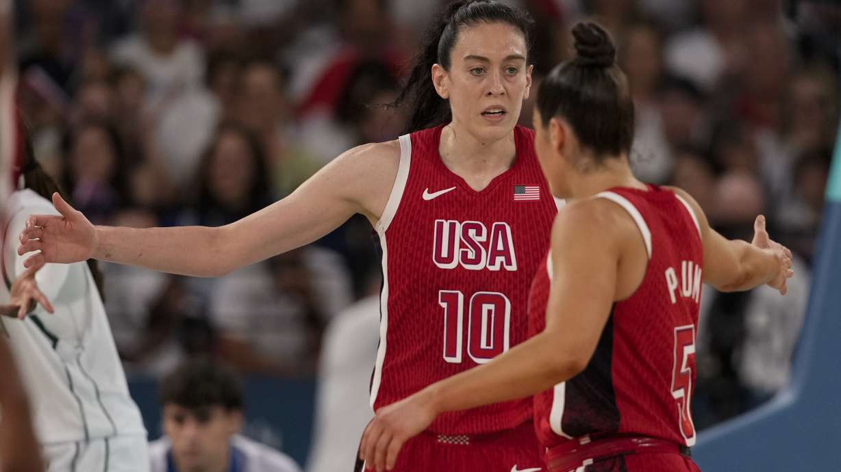 United States' Breanna Stewart (10) celebrates with Kelsey Plum (5) after a basket against Nigeria during a women's quarterfinal game at Bercy Arena at the 2024 Summer Olympics, Wednesday, Aug. 7, 2024, in Paris, France.