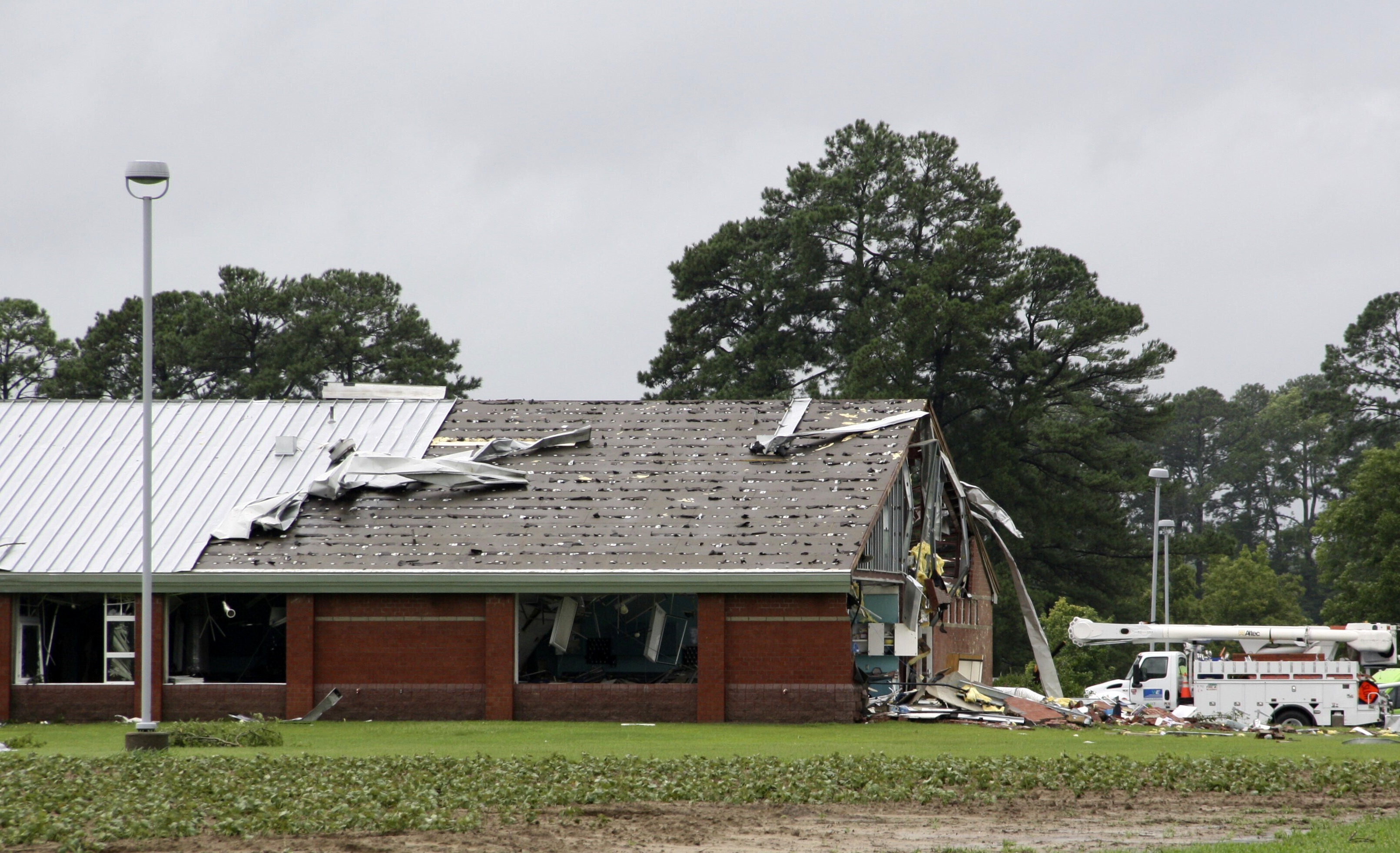 Parts of Springfield Middle School lay on the ground after being ripped off by a tornado spawned by Tropical Storm Debby, in Lucama, N.C., Thursday.