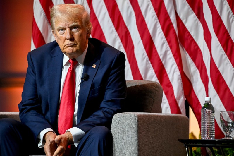 Republican presidential nominee and former president Donald Trump looks on during a panel of the National Association of Black Journalists convention in Chicago, Ill., July 31. Trump and Vice President Kamala Harris have agreed to a debate on Sept. 10. 