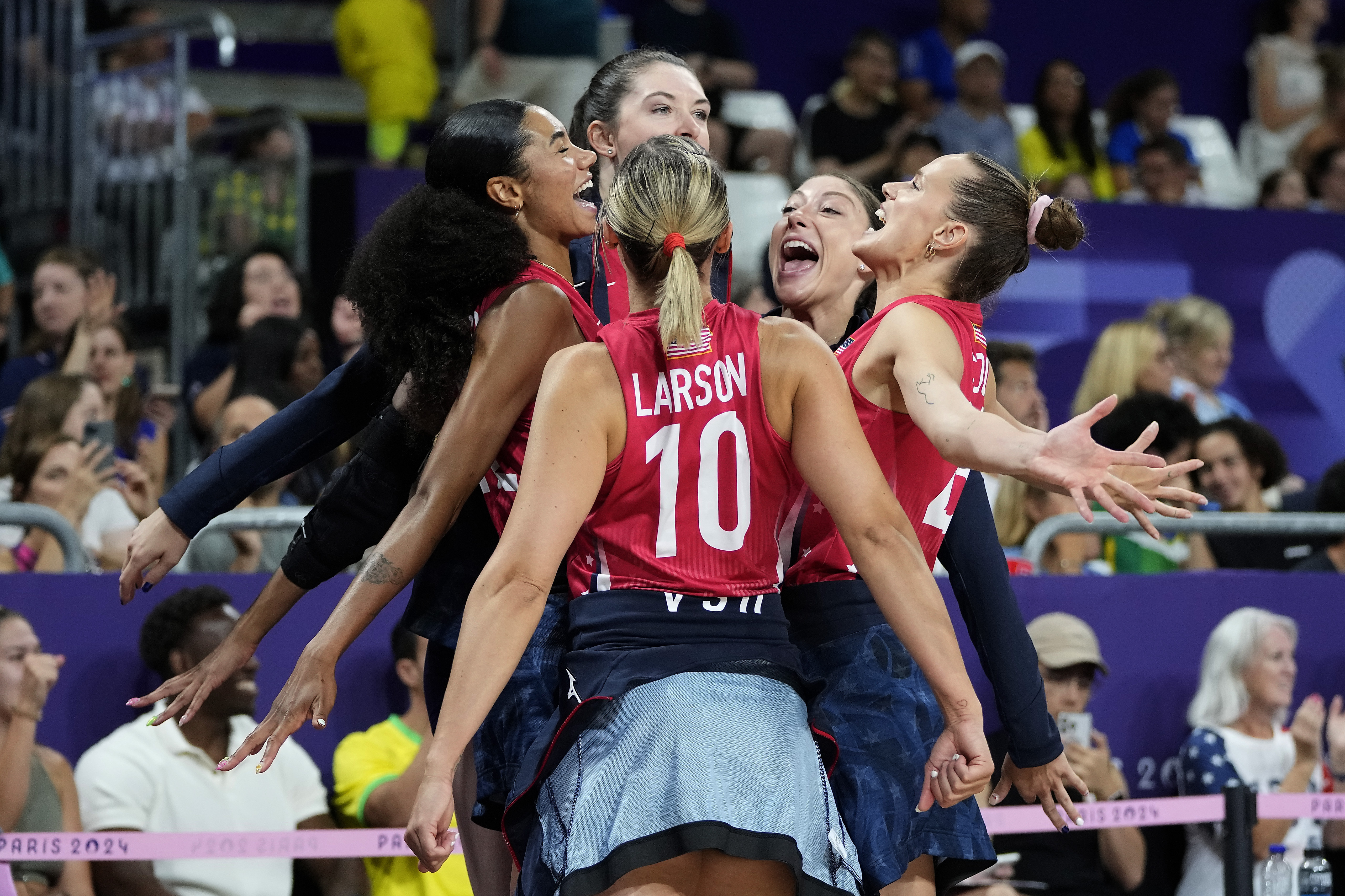 Players for the United States celebrate during a semifinal women's volleyball match against Brazil at the 2024 Summer Olympics, Thursday, Aug. 8, 2024, in Paris, France. 