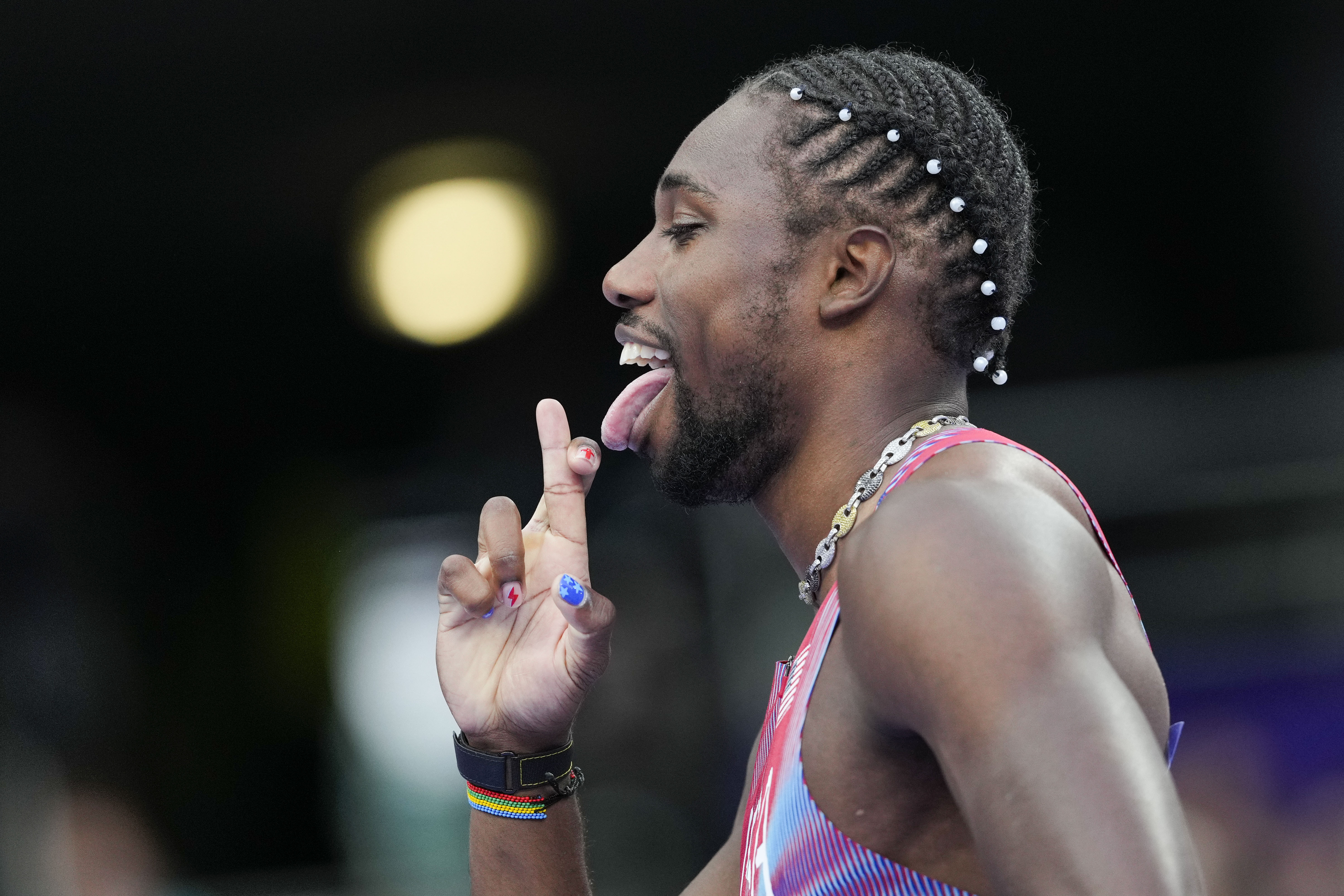 Noah Lyles, of the United States, competes during the men's 200-meter semifinal at the 2024 Summer Olympics, Wednesday, Aug. 7, 2024, in Saint-Denis, France. 