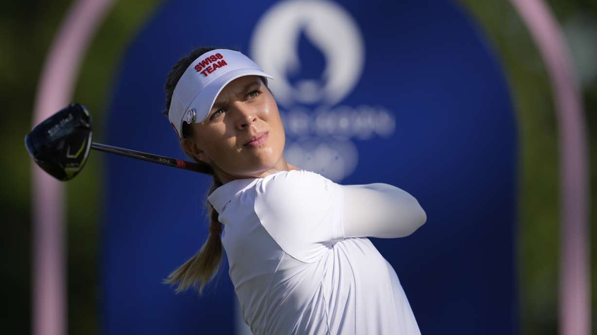 Morgane Metraux, of Switzerland, hits her shot from the 4th tee during the second round of the women's golf event at the 2024 Summer Olympics, Thursday, Aug. 8, 2024, at Le Golf National, in Saint-Quentin-en-Yvelines, France.