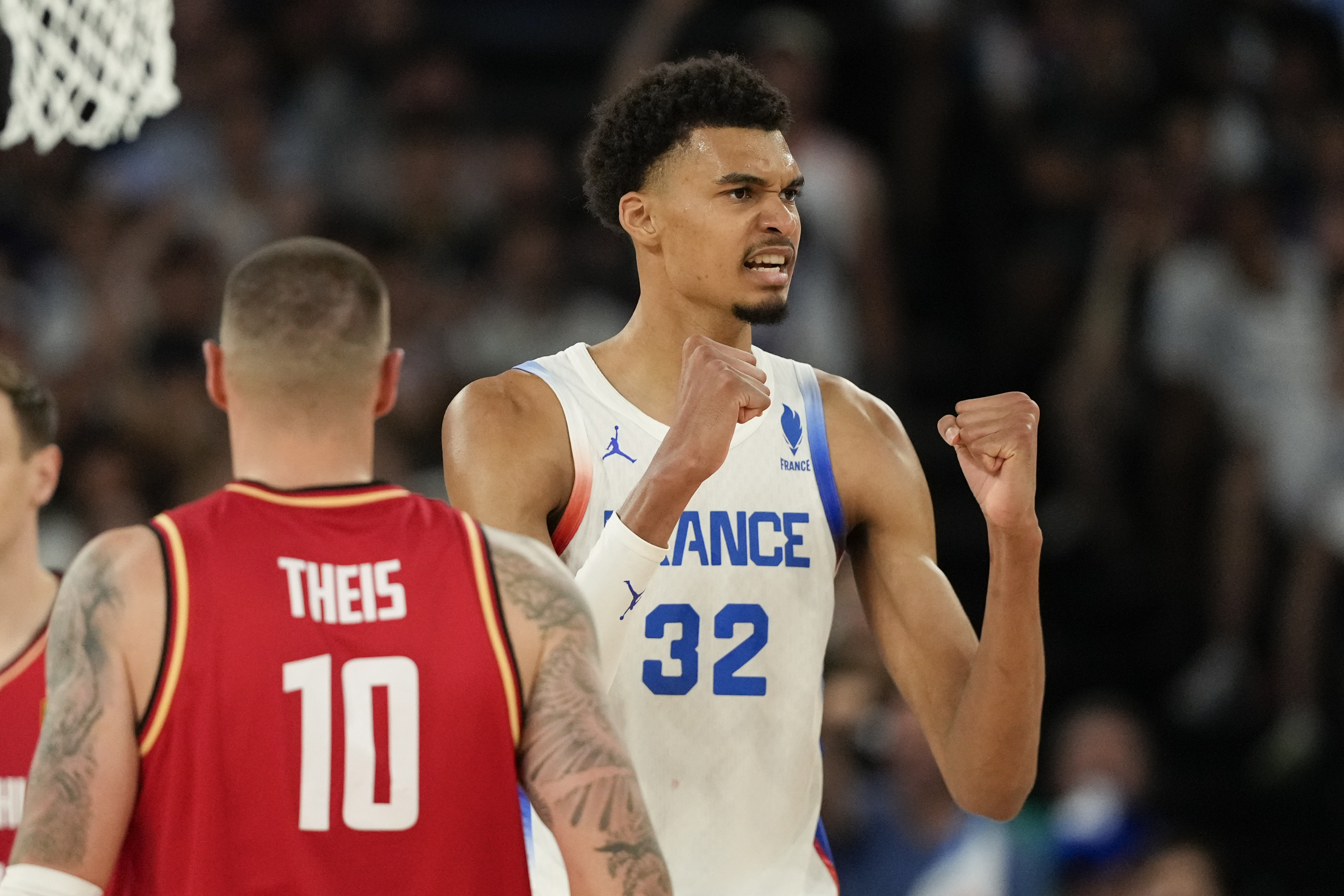 Victor Wembanyama (32), of France celebrates a basket against Germany during a men's semifinals basketball game at Bercy Arena at the 2024 Summer Olympics, Thursday, Aug. 8, 2024, in Paris, France. 