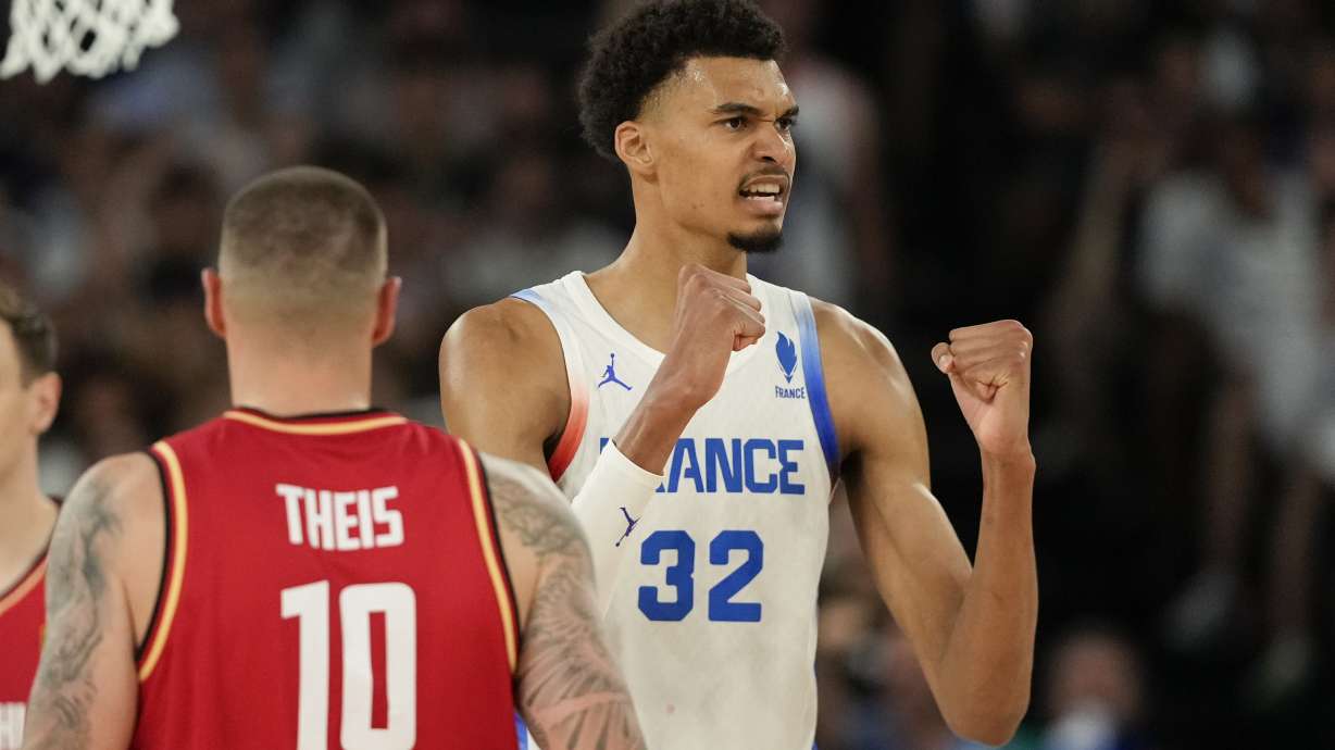 Victor Wembanyama (32), of France celebrates a basket against Germany during a men's semifinals basketball game at Bercy Arena at the 2024 Summer Olympics, Thursday, Aug. 8, 2024, in Paris, France.
