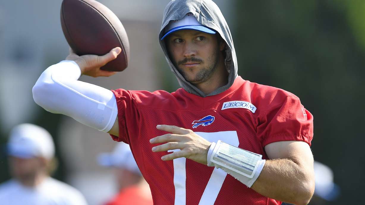 FILE - Buffalo Bills quarterback Josh Allen (17) throws during an NFL football training camp practice in Pittsford, N.Y., on July 24, 2024.