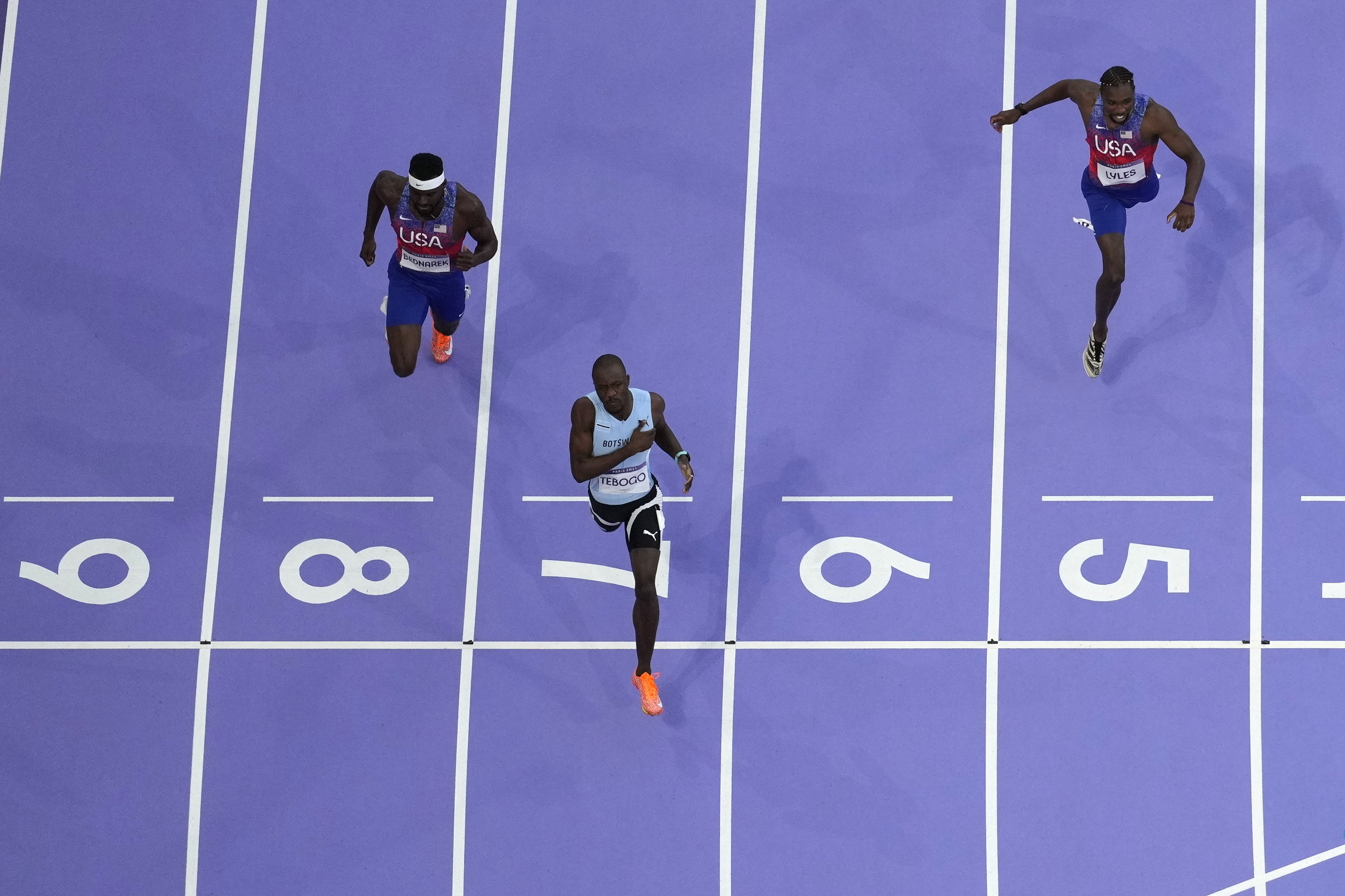 Letsile Tebogo, of Botswana, lane seven, wins the men's 200-meter final at the 2024 Summer Olympics, Thursday, Aug. 8, 2024, in Saint-Denis, France. 