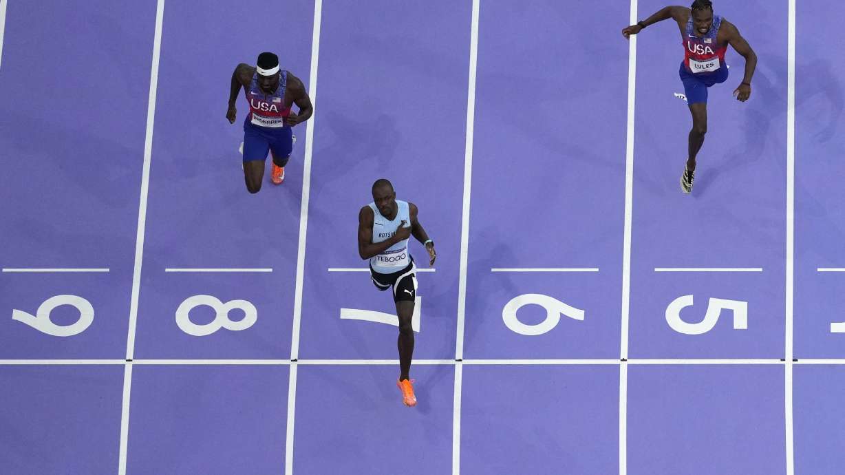 Letsile Tebogo, of Botswana, lane seven, wins the men's 200-meter final at the 2024 Summer Olympics, Thursday, Aug. 8, 2024, in Saint-Denis, France.