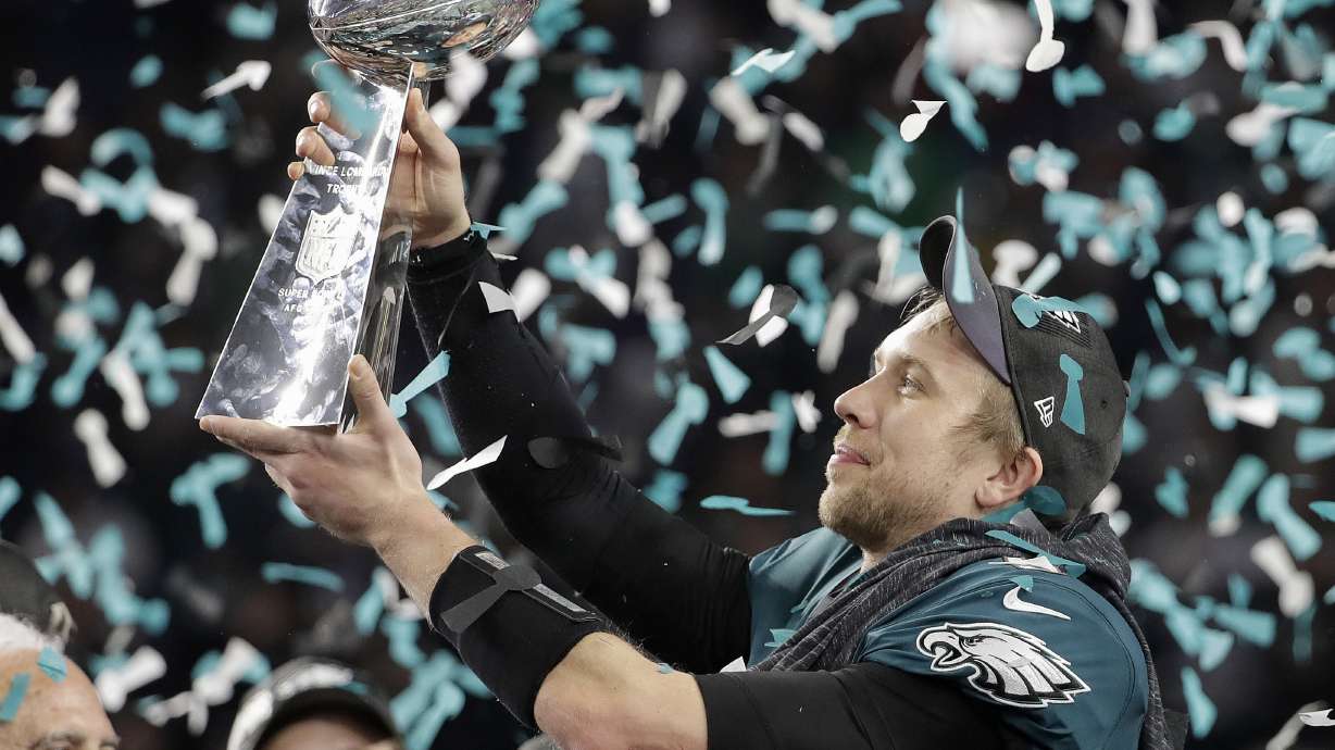 FILE - Philadelphia Eagles' Nick Foles holds up the Vince Lombardi Trophy after the NFL Super Bowl 52 football game against the New England Patriots, Sunday, Feb. 4, 2018, in Minneapolis.