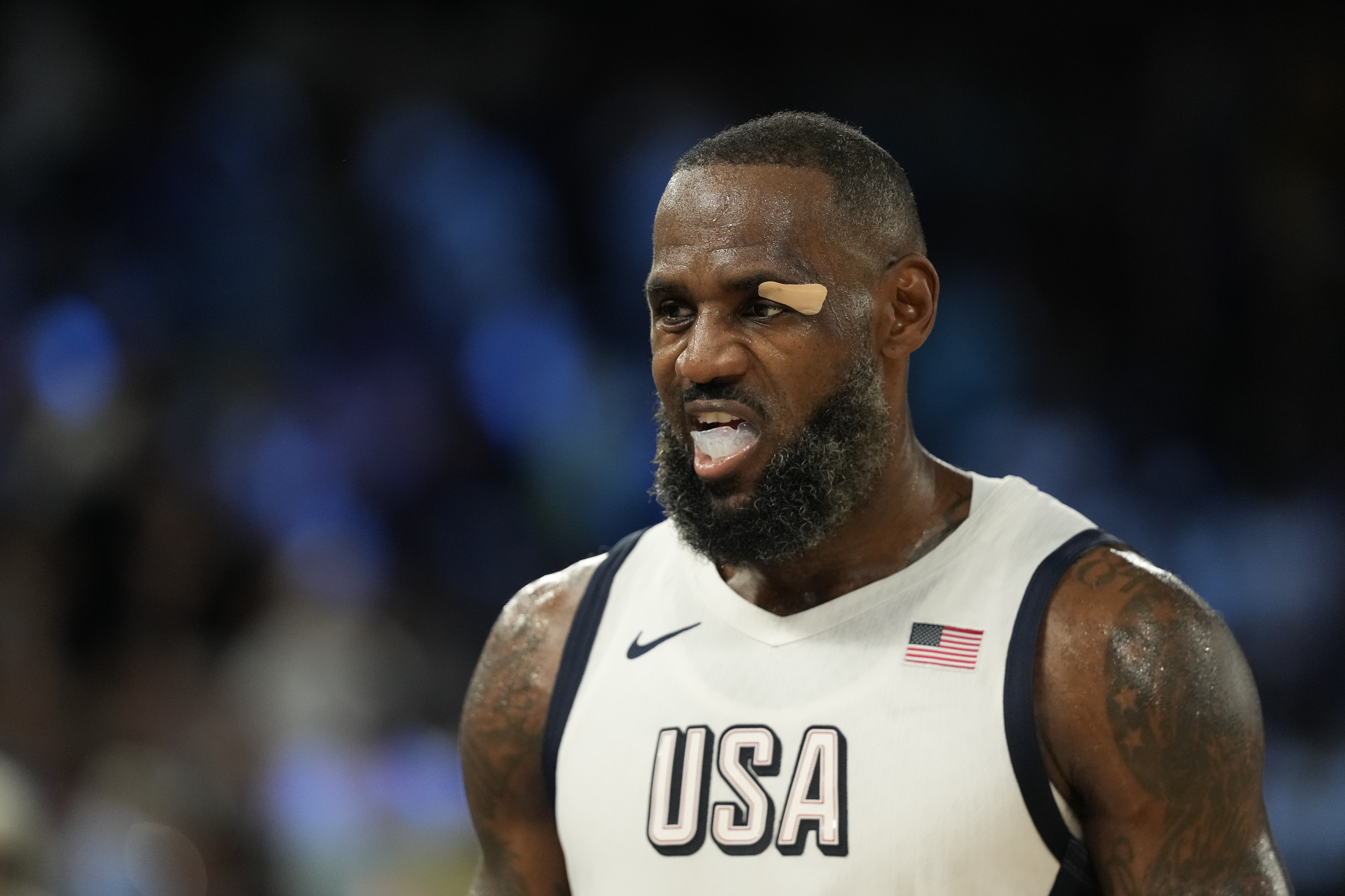 United States' LeBron James (6) reacts to a call against Serbia during a men's semifinals basketball game at Bercy Arena at the 2024 Summer Olympics, Thursday, Aug. 8, 2024, in Paris, France. 