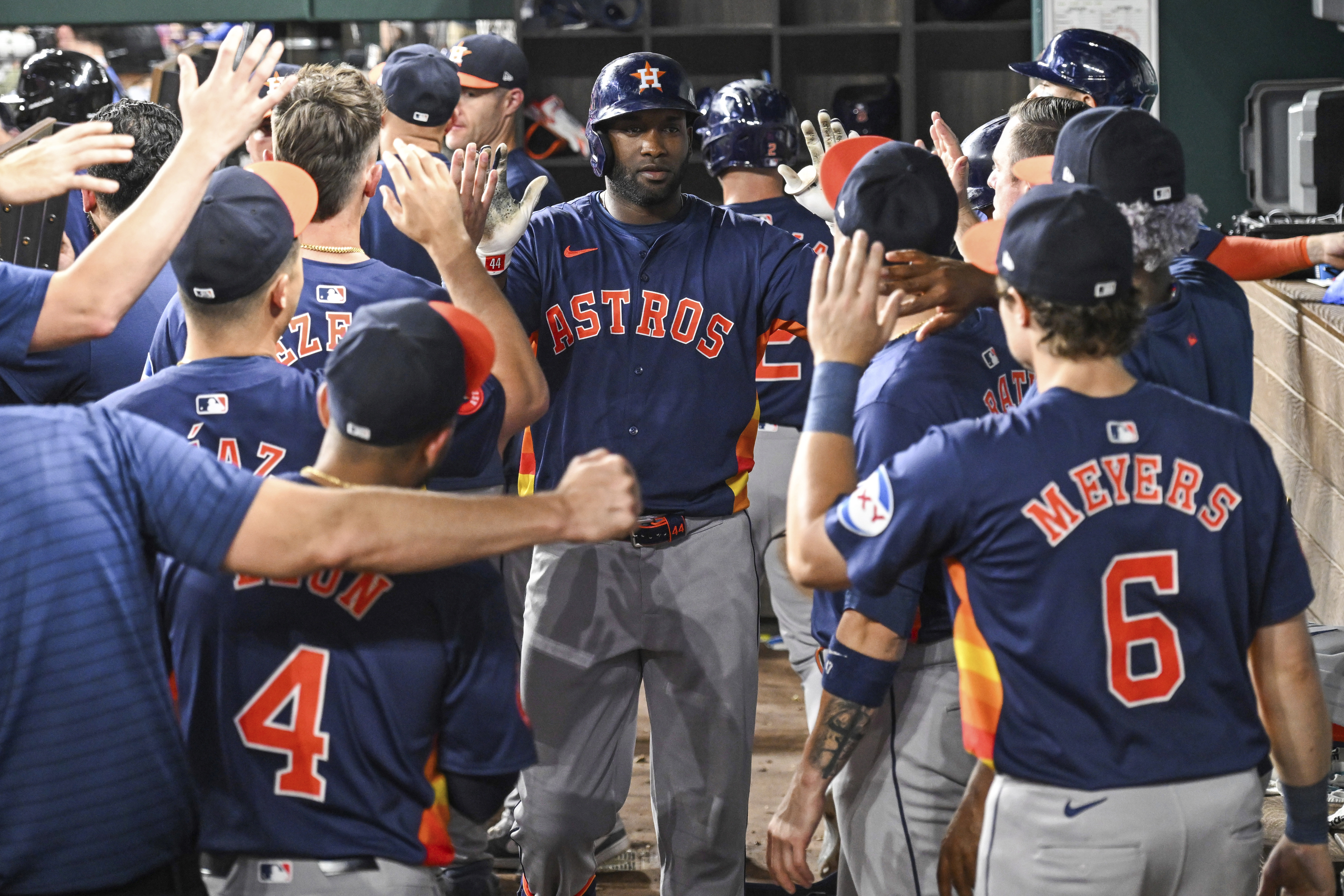Houston Astros Yordan Alvarez, celebrates in the dugout after hitting a two run home run in the ninth inning of a baseball game against the Texas Rangers, Tuesday, Aug 6, 2024, in Arlington, Texas. 