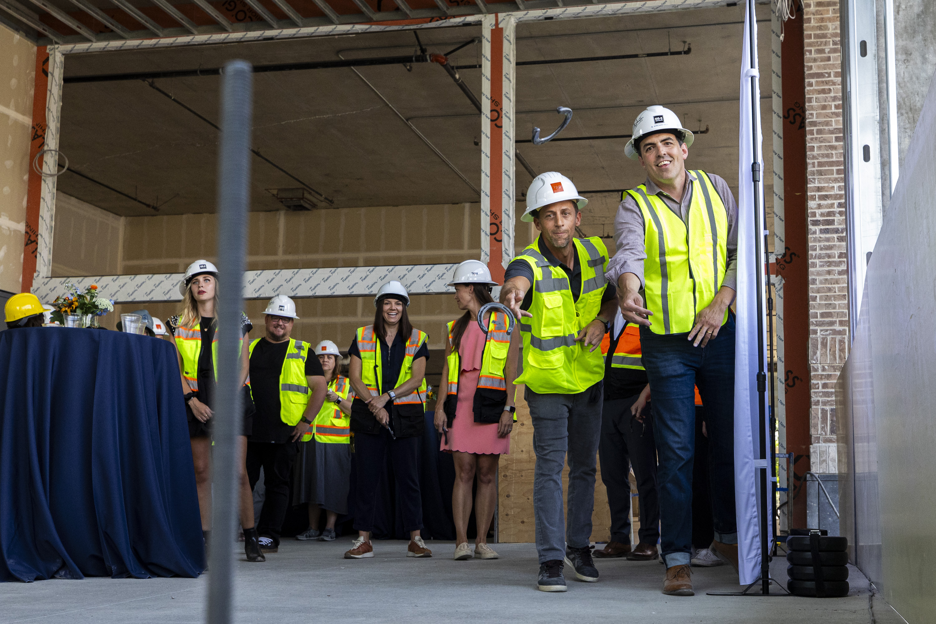 Brooks Kirchheimer, right, and Ben Lowe throw horseshoes to commemorate a groundbreaking ceremony held by Leave Room For Dessert Eateries at the future site of Hearth and Hill and also Hill’s Kitchen in Salt Lake City on Thursday.